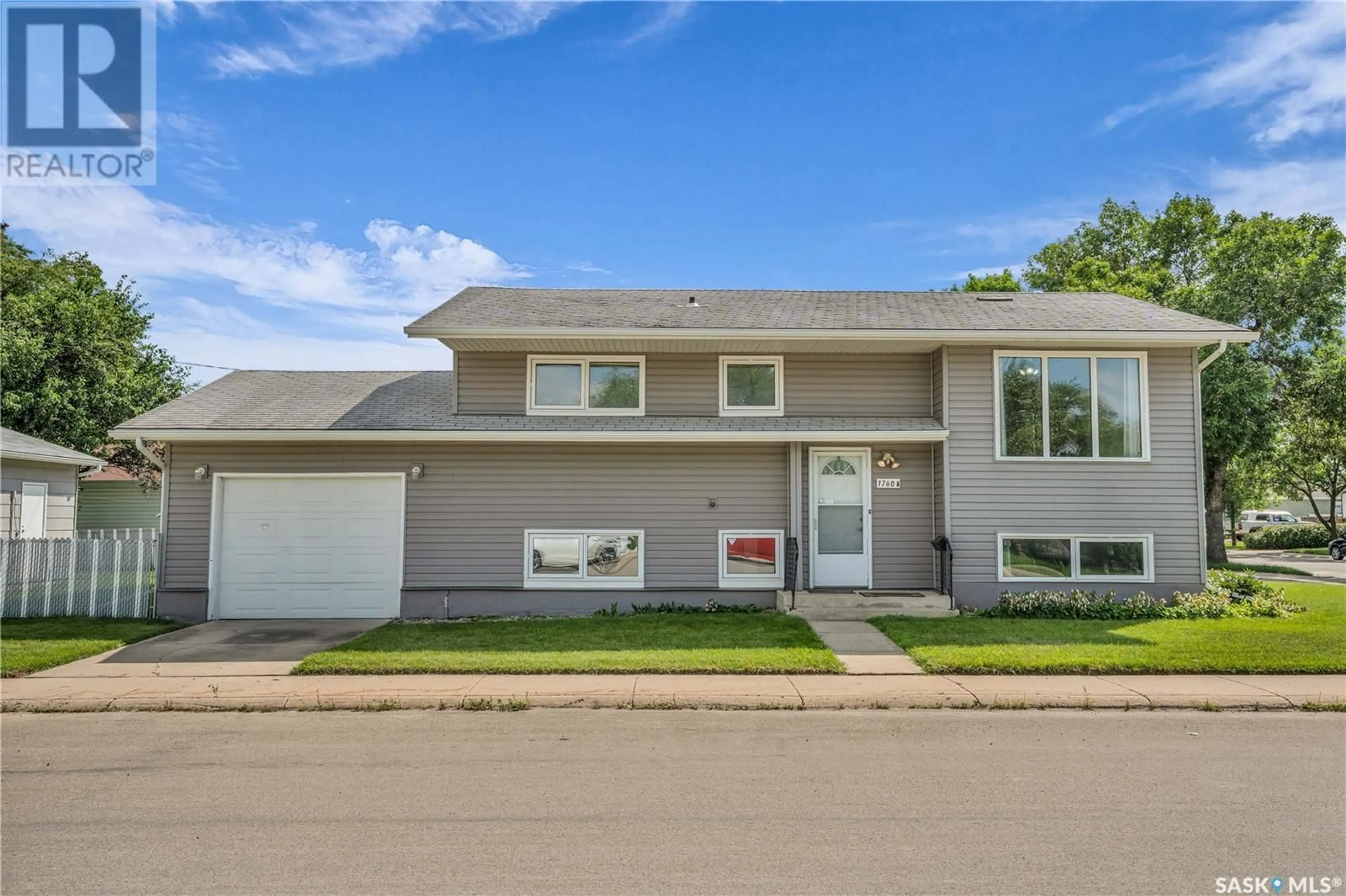 Home with vinyl exterior material, street for 1740 G AVENUE, Saskatoon Saskatchewan S7L5A1