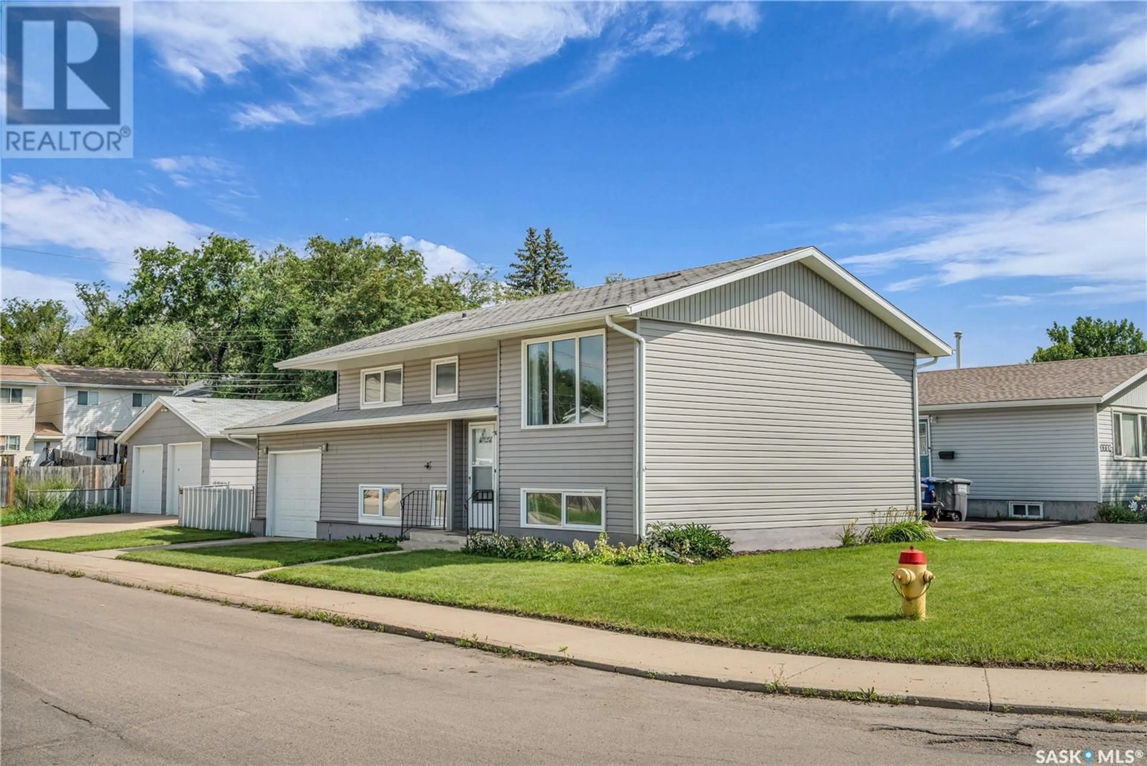 Home with vinyl exterior material, street for 1740 G AVENUE, Saskatoon Saskatchewan S7L5A1
