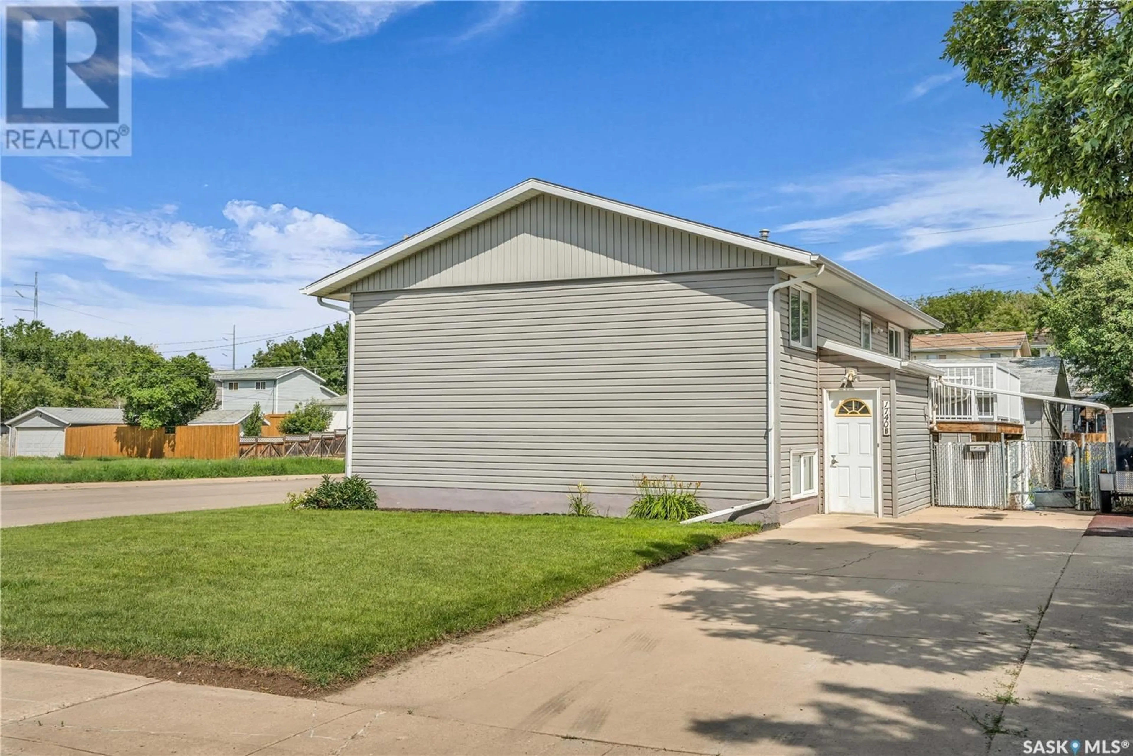 Home with vinyl exterior material, street for 1740 G AVENUE, Saskatoon Saskatchewan S7L5A1