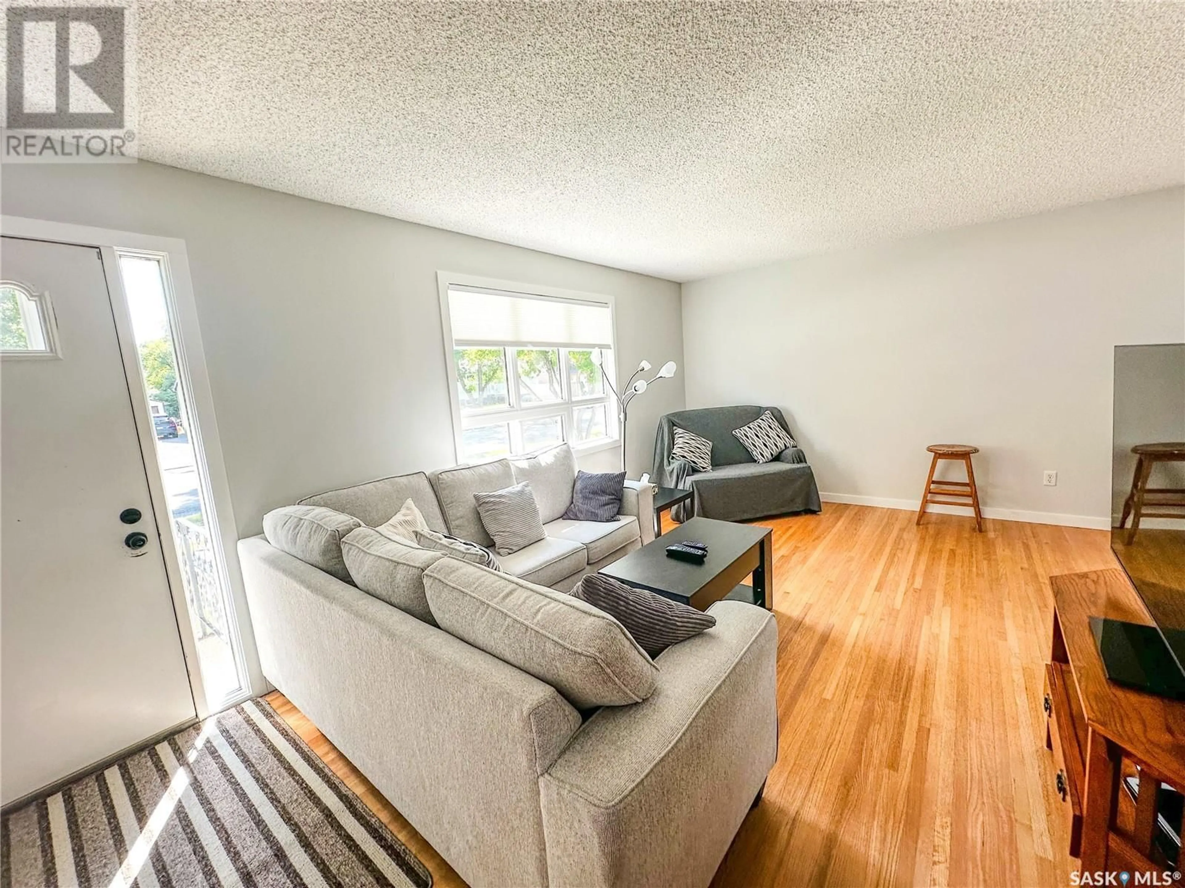 Living room with furniture, wood/laminate floor for 218 5TH AVENUE, Yorkton Saskatchewan S3N0Z6