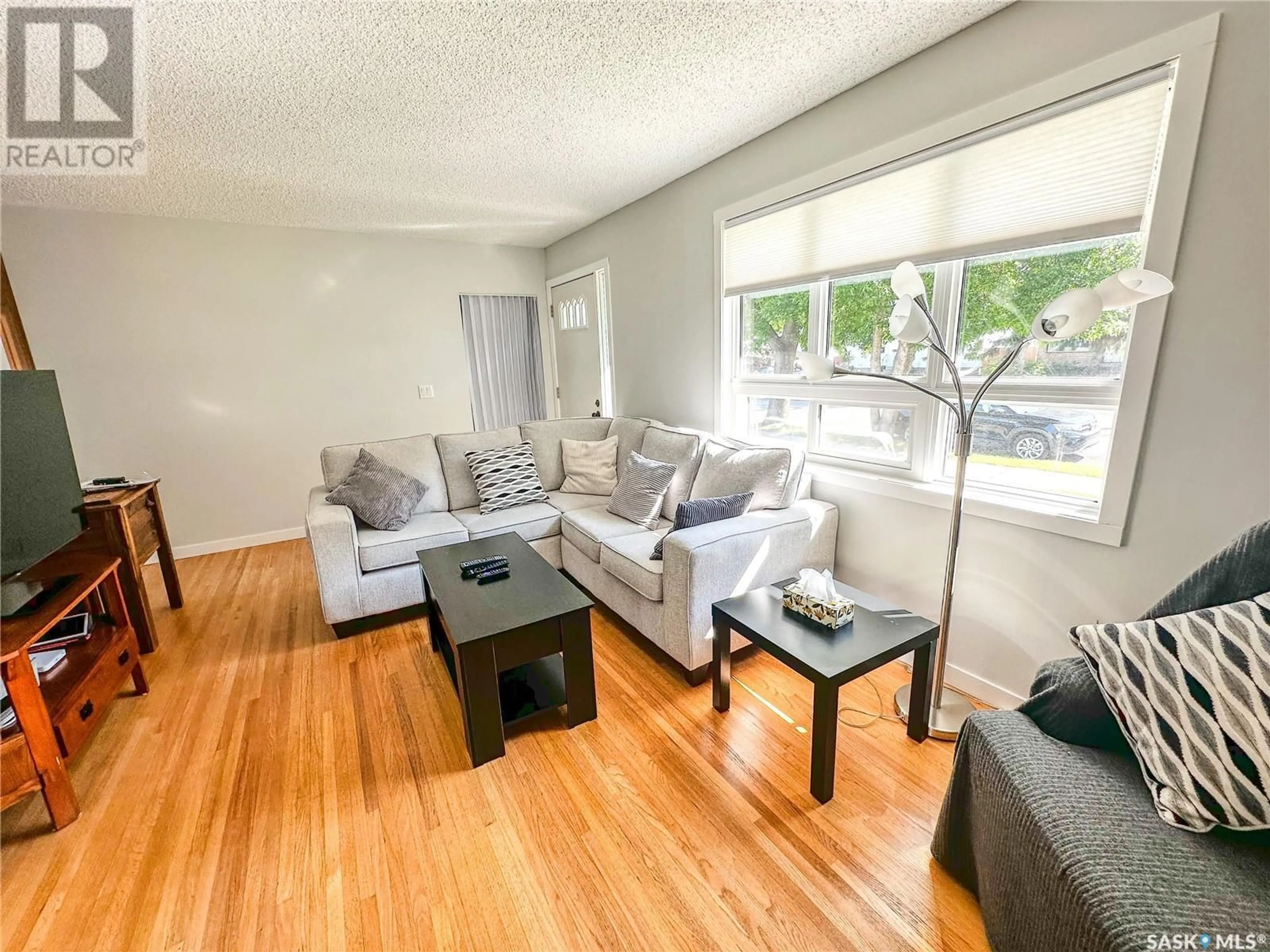 Living room with furniture, wood/laminate floor for 218 5TH AVENUE, Yorkton Saskatchewan S3N0Z6