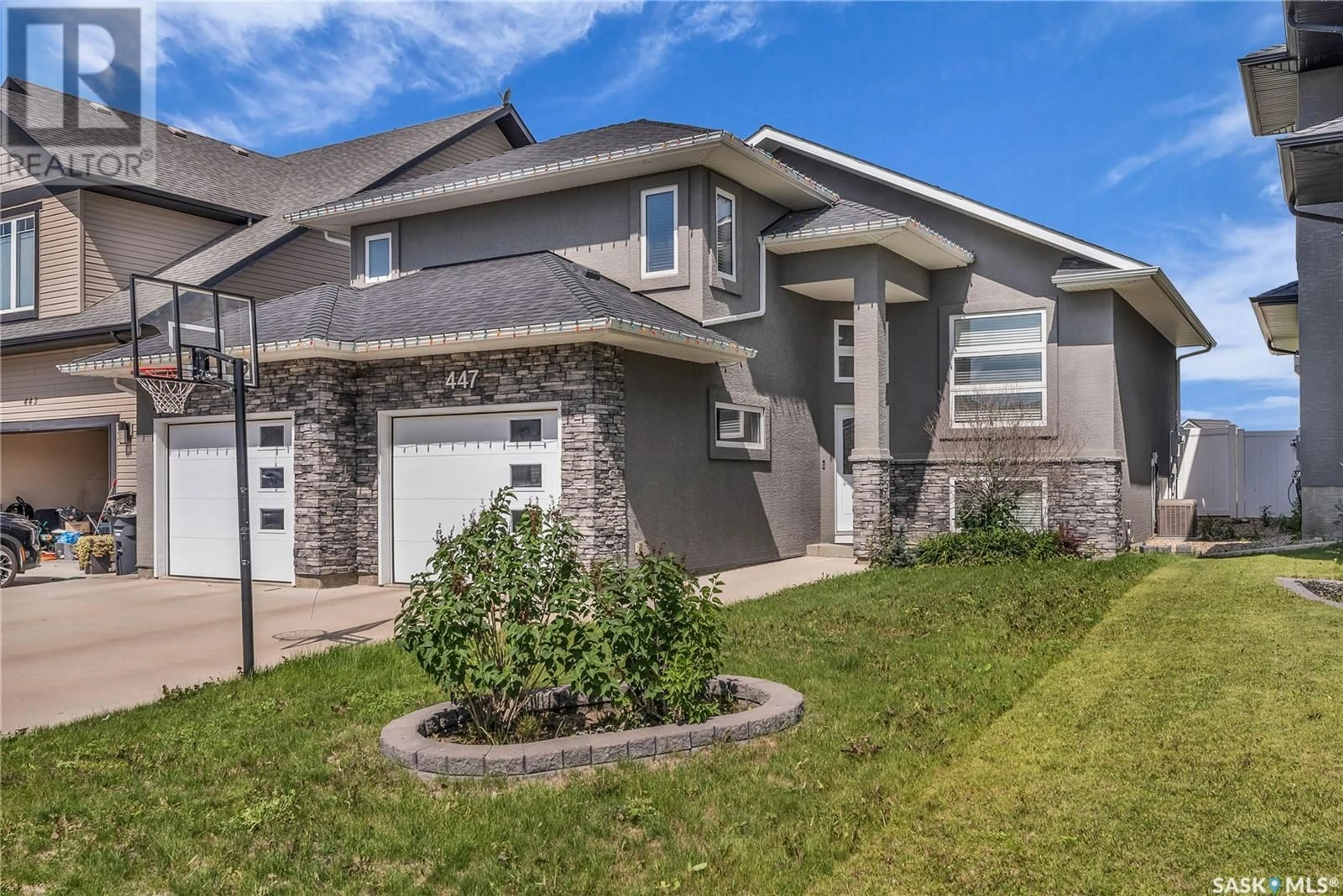 Home with brick exterior material, street for 447 MAHABIR CRESCENT, Saskatoon Saskatchewan S7W0J7