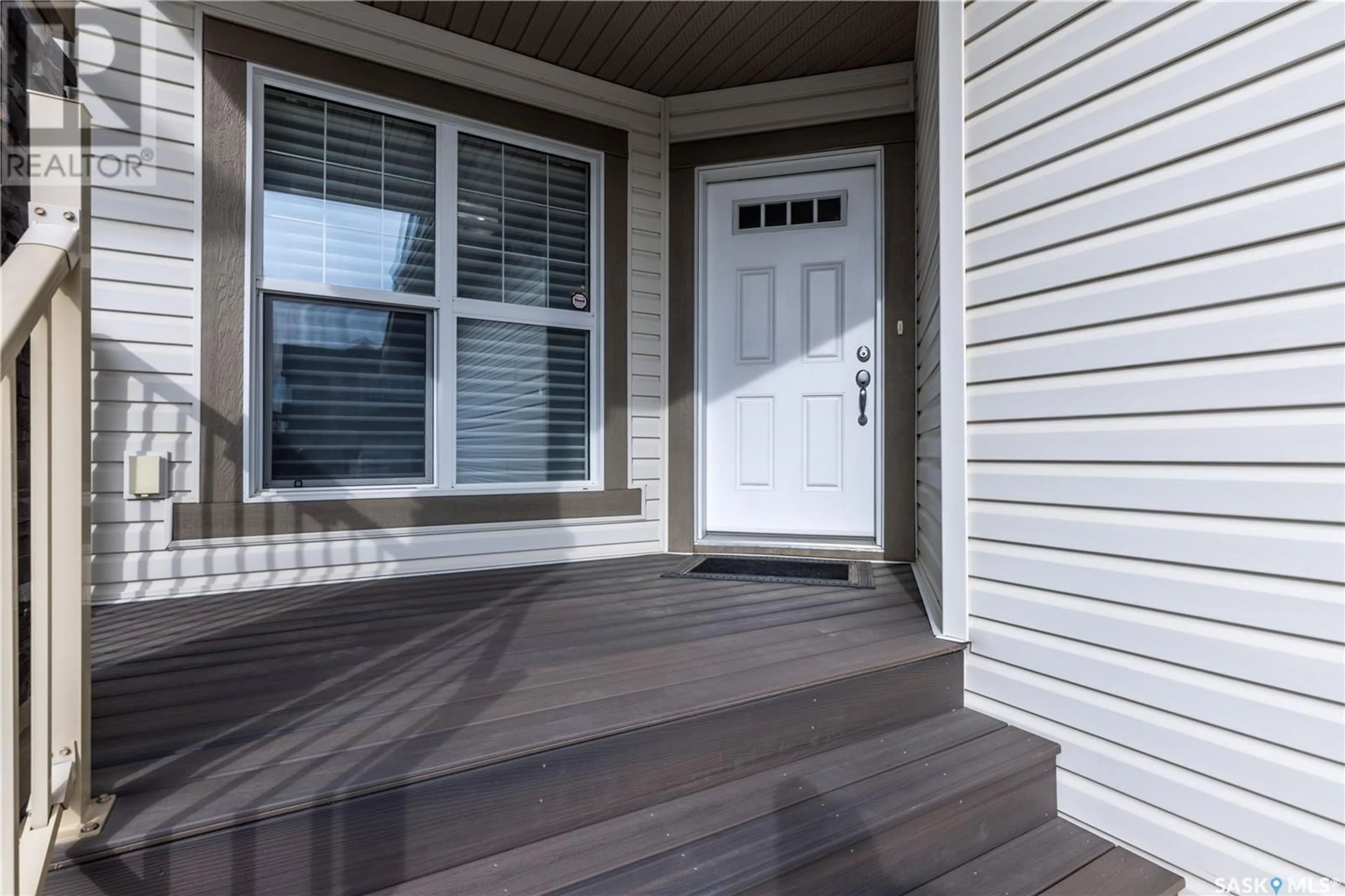 Home with vinyl exterior material, street for 411 FLYNN LANE, Saskatoon Saskatchewan S7V0L1