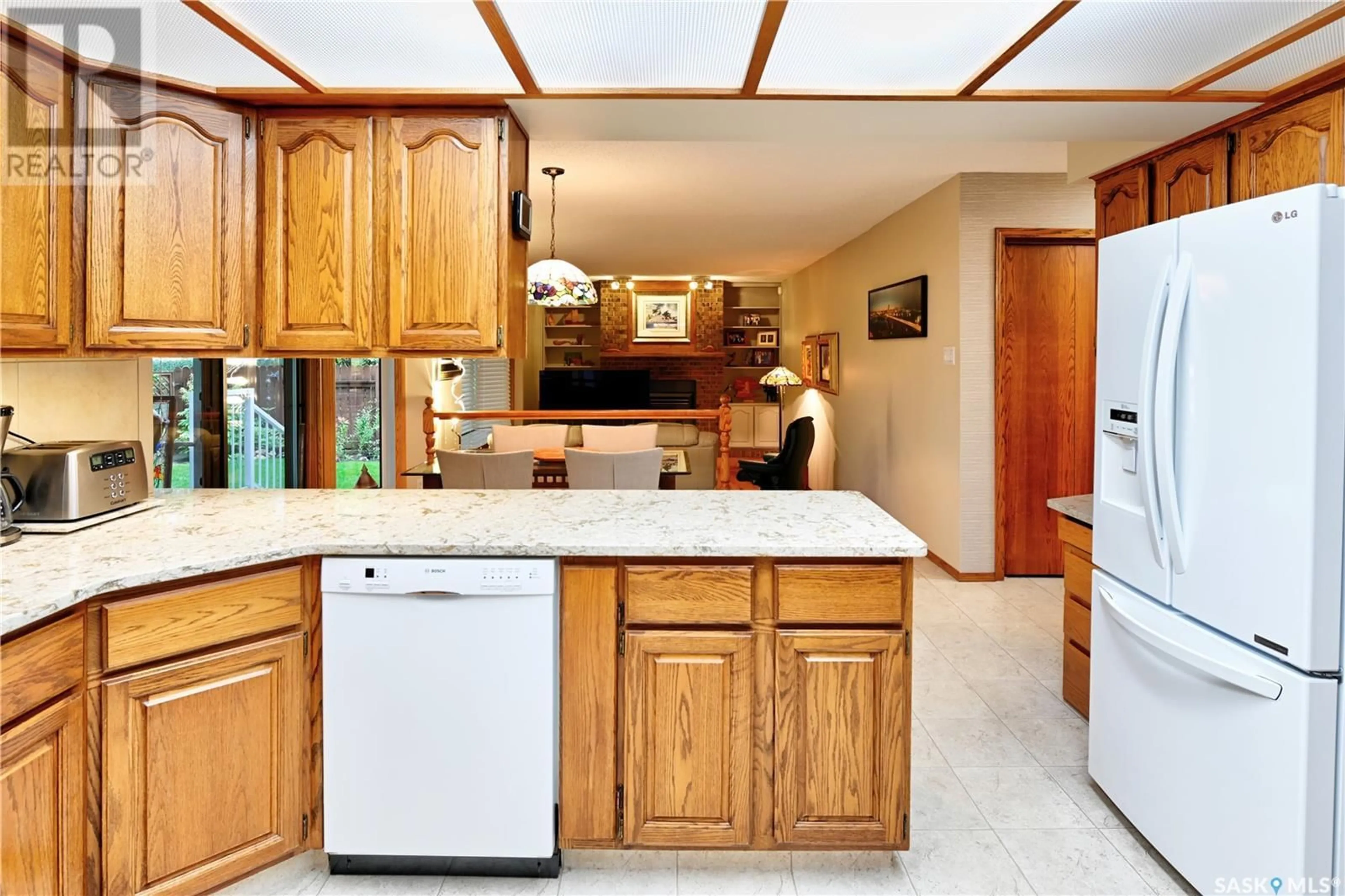 Open concept kitchen, ceramic/tile floor for 213 BADGER COURT, Saskatoon Saskatchewan S7N2X2