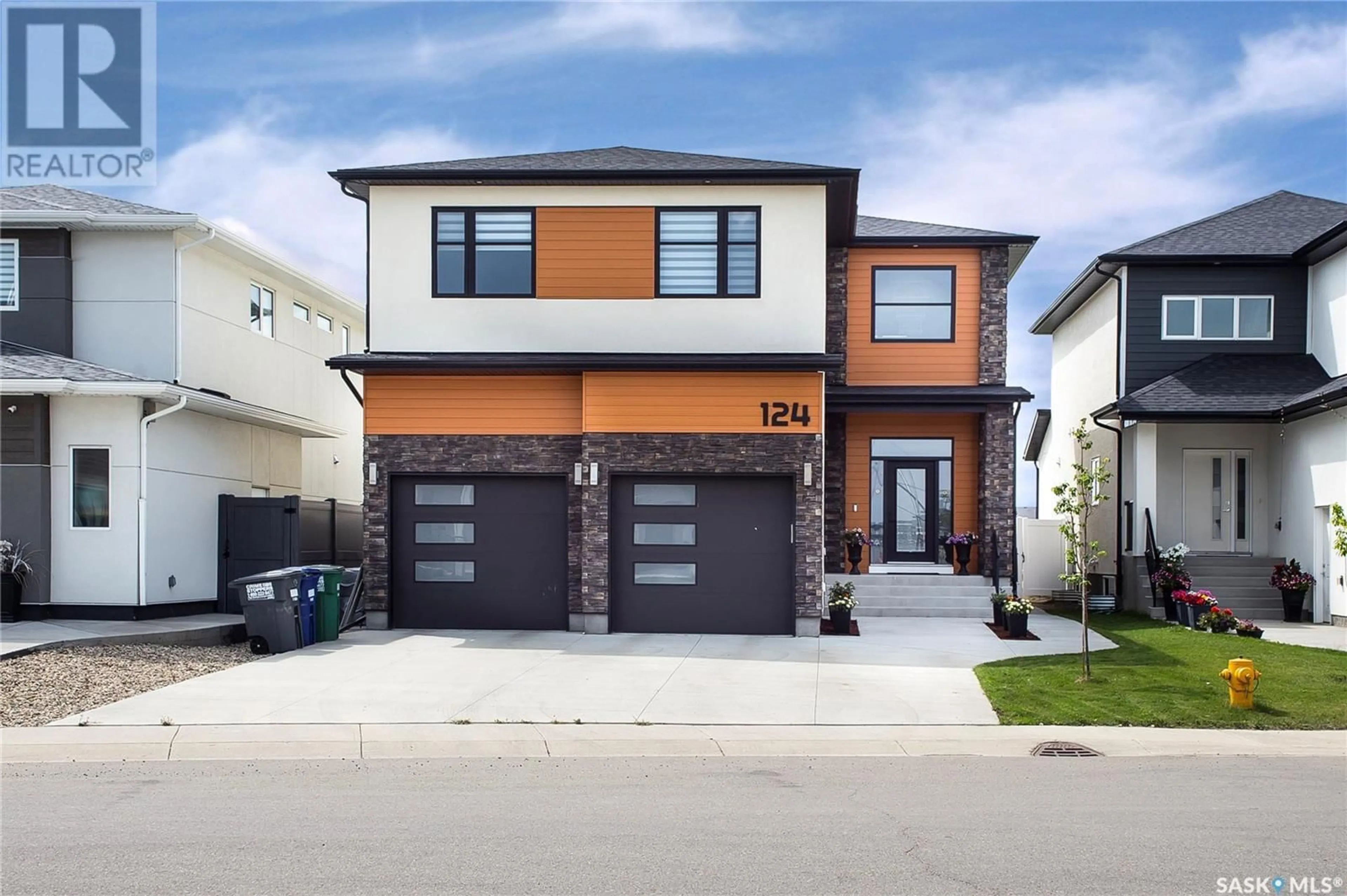 Home with brick exterior material, street for 124 FORSEY AVENUE, Saskatoon Saskatchewan S7W1C8