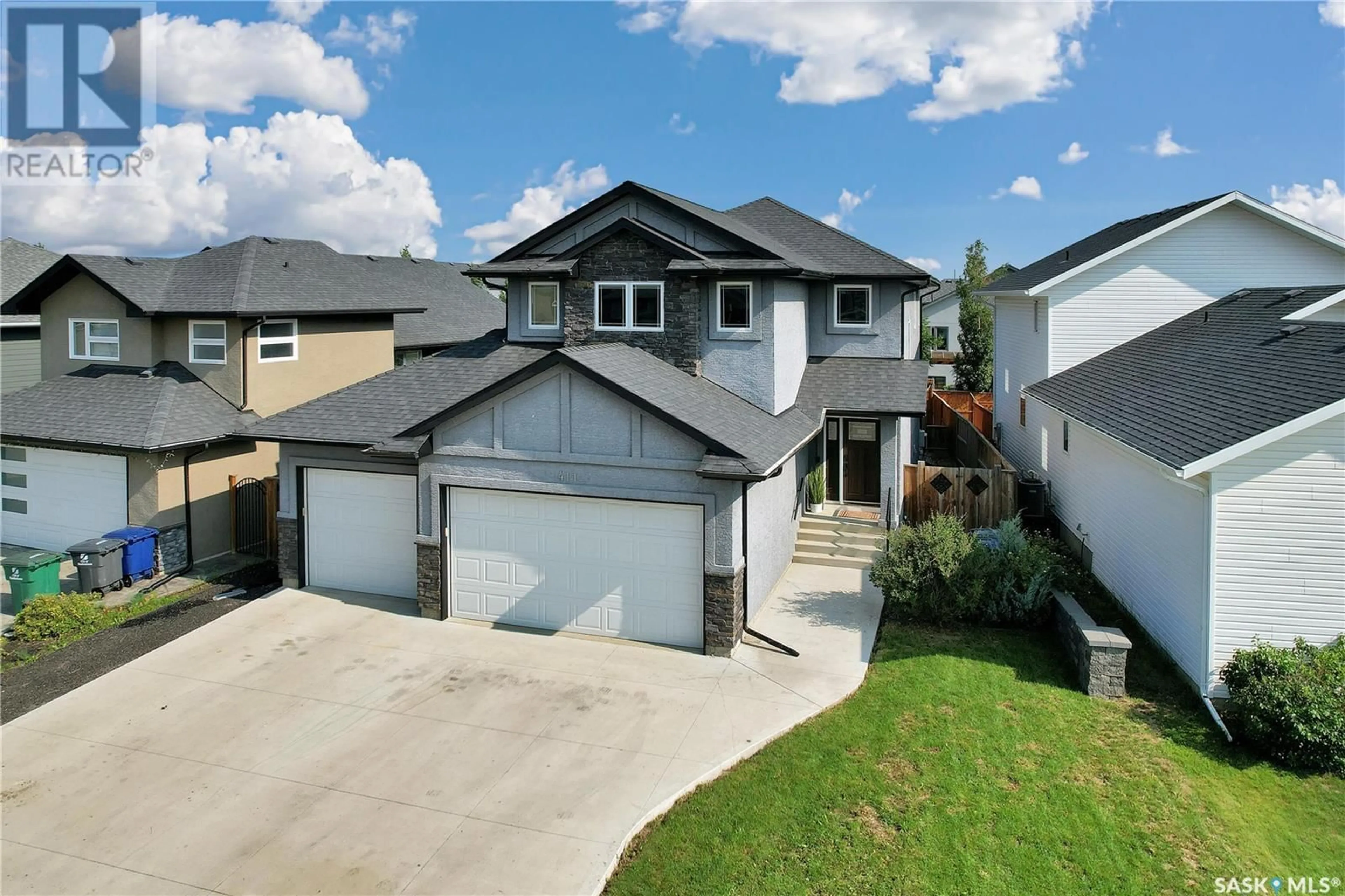 A pic from outside/outdoor area/front of a property/back of a property/a pic from drone, street for 411 HASTINGS CRESCENT, Saskatoon Saskatchewan S7V0C7