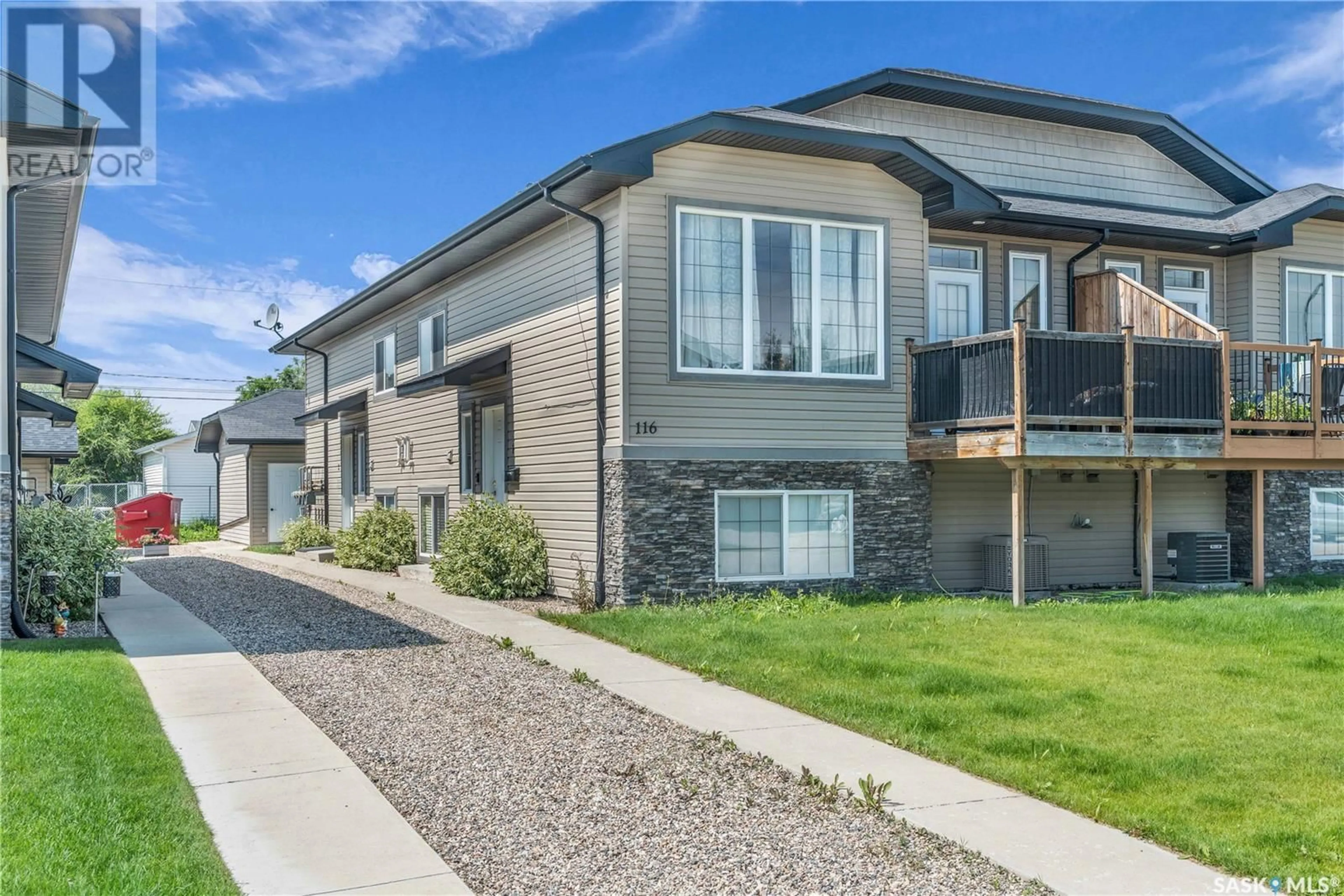Home with vinyl exterior material, street for 2 116 HIEBERT CRESCENT, Martensville Saskatchewan S0K2T2