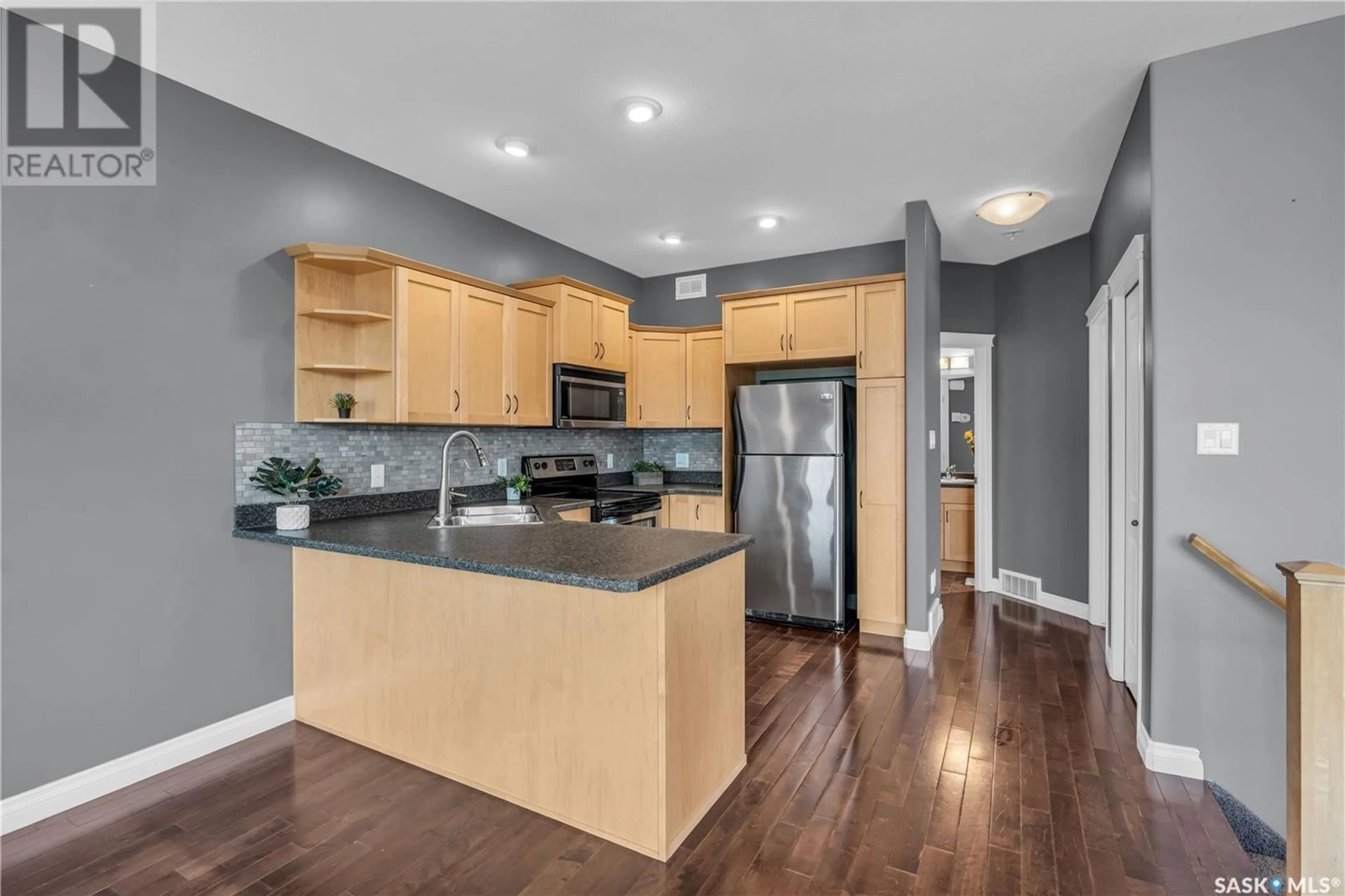 Open concept kitchen, wood/laminate floor for 2 116 HIEBERT CRESCENT, Martensville Saskatchewan S0K2T2