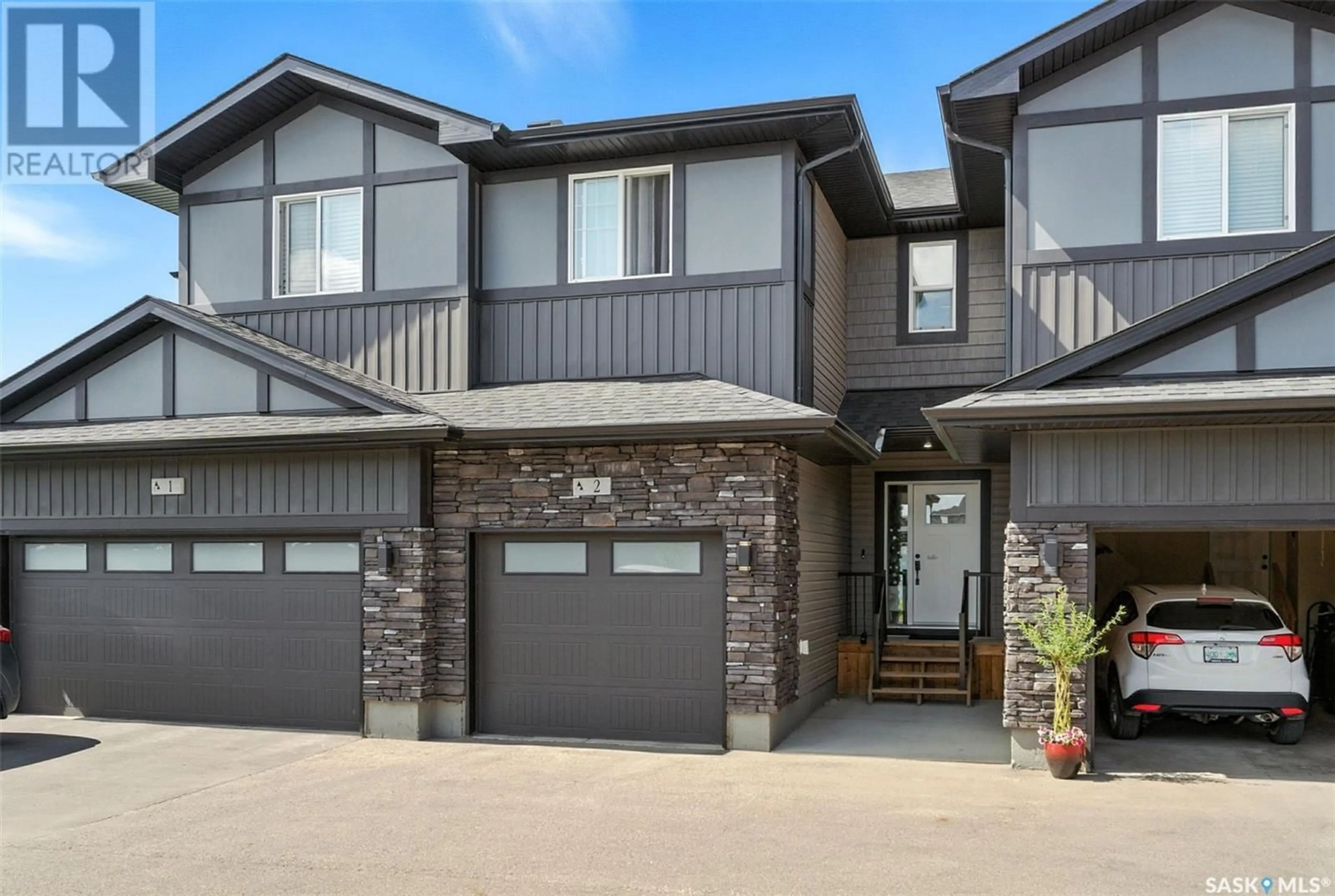 Home with vinyl exterior material, street for 525 - 2 MAHABIR LANE, Saskatoon Saskatchewan S7W1G1