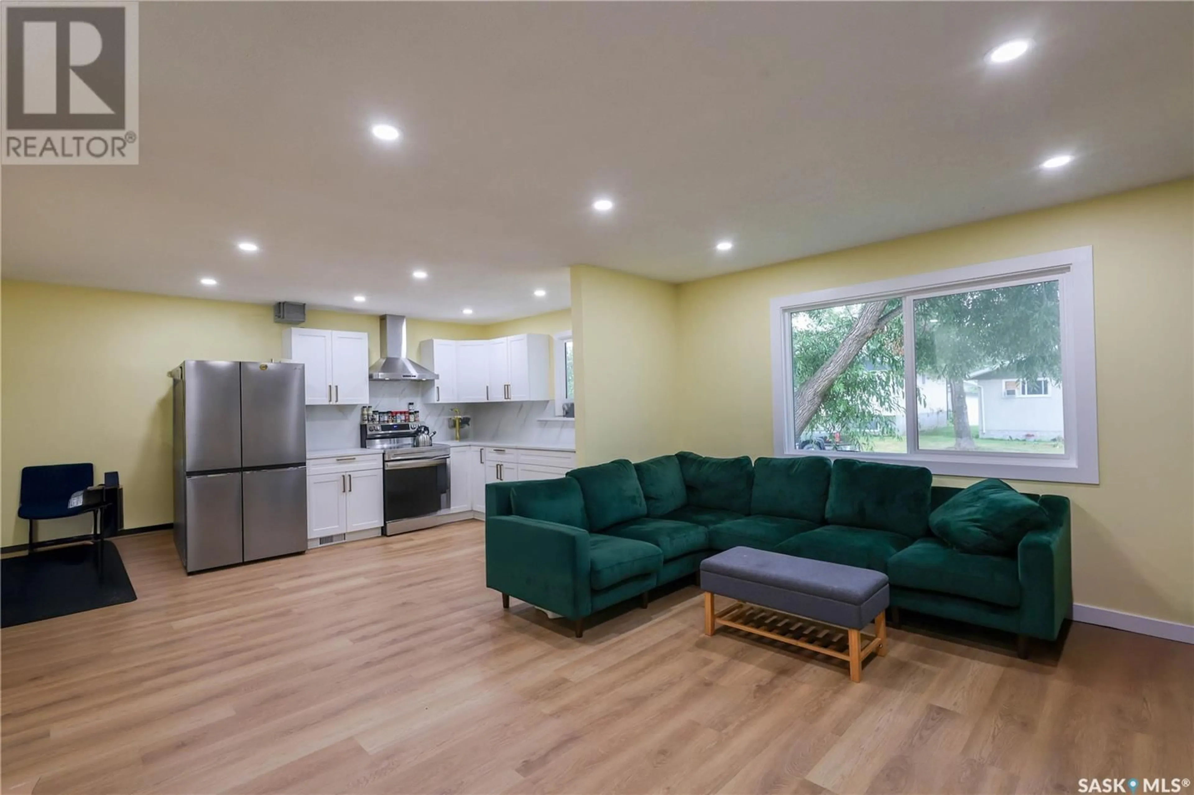 Open concept kitchen, wood/laminate floor for 16 KEMP CRESCENT, Prince Albert Saskatchewan S6V6H1