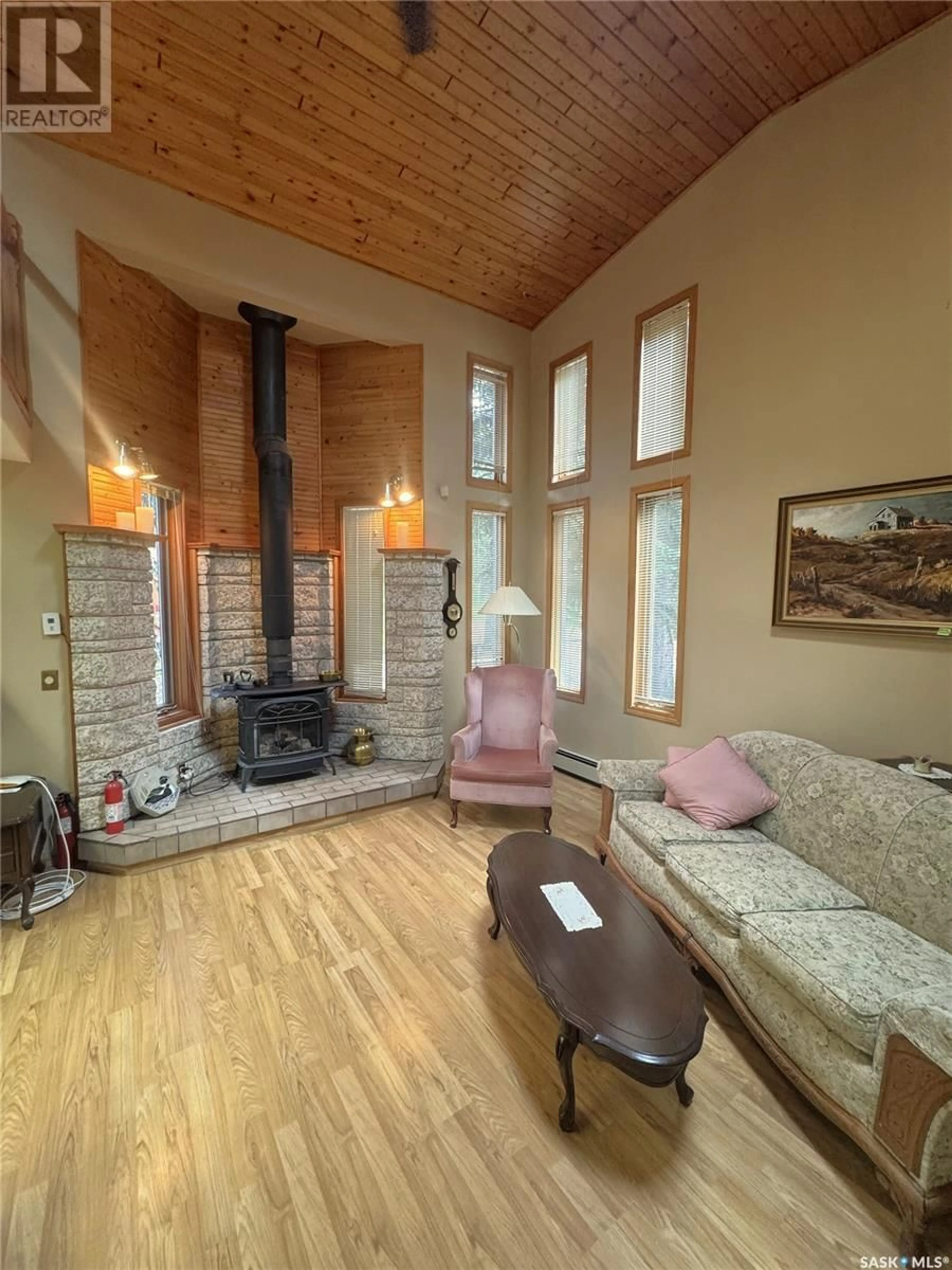 Living room with furniture, wood/laminate floor for 308 FRANCIS AVENUE, Lakeland Rm No. 521 Saskatchewan S0J0N0