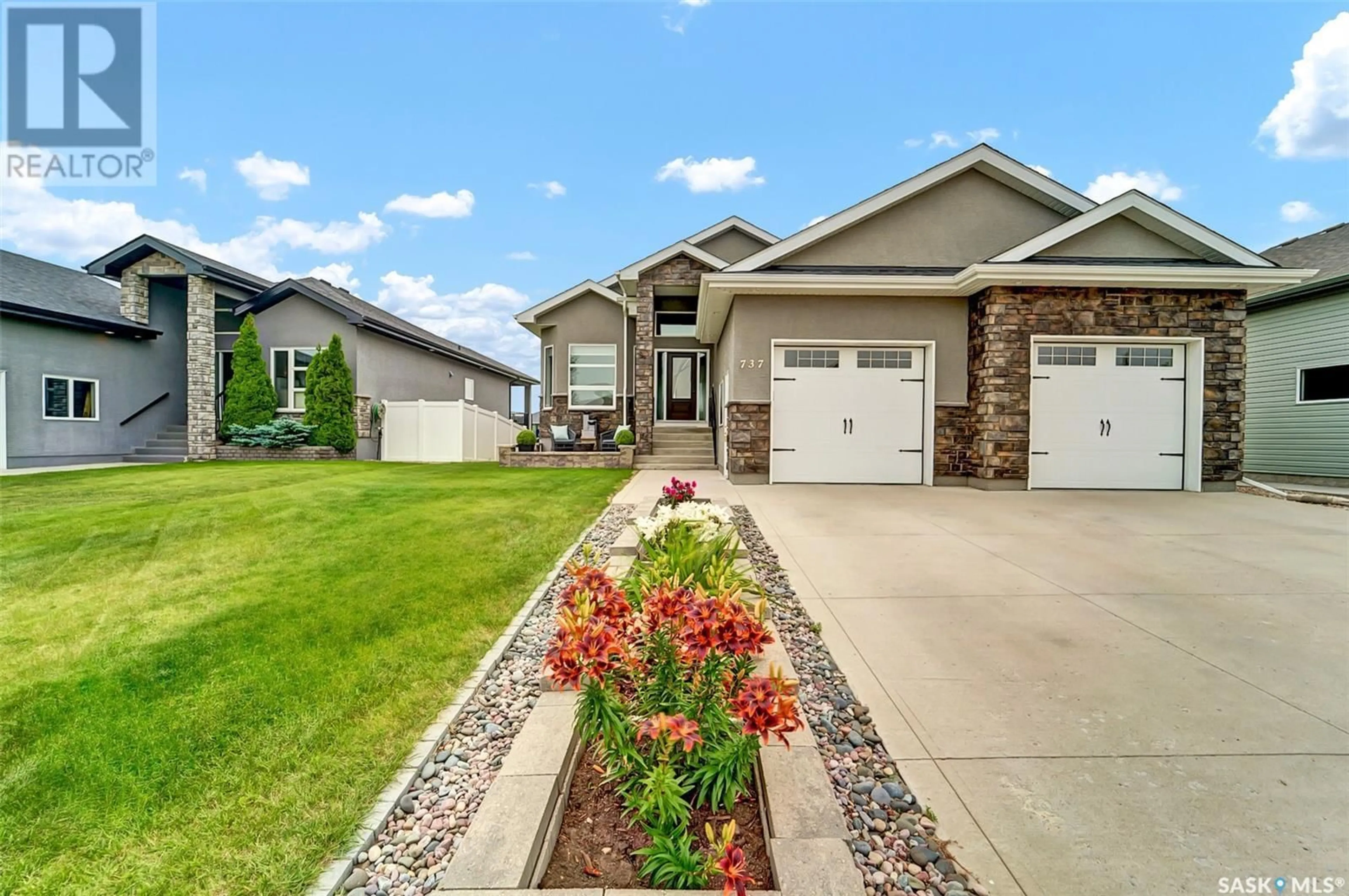 Home with vinyl exterior material, street for 737 GOWAN ROAD, Warman Saskatchewan S0K4S2
