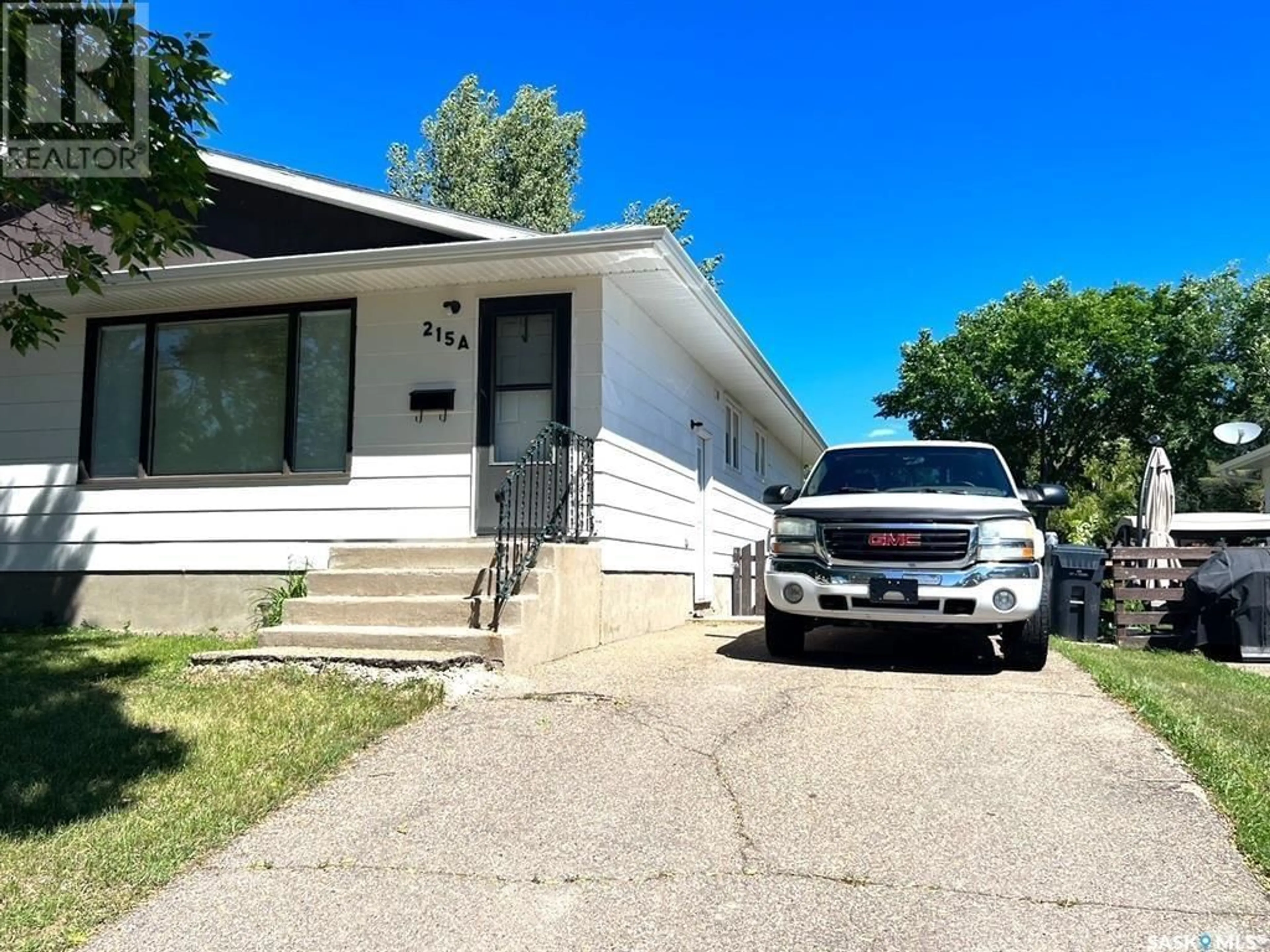 Home with vinyl exterior material, street for 215 PELLETIER DRIVE, Swift Current Saskatchewan S9H4K3