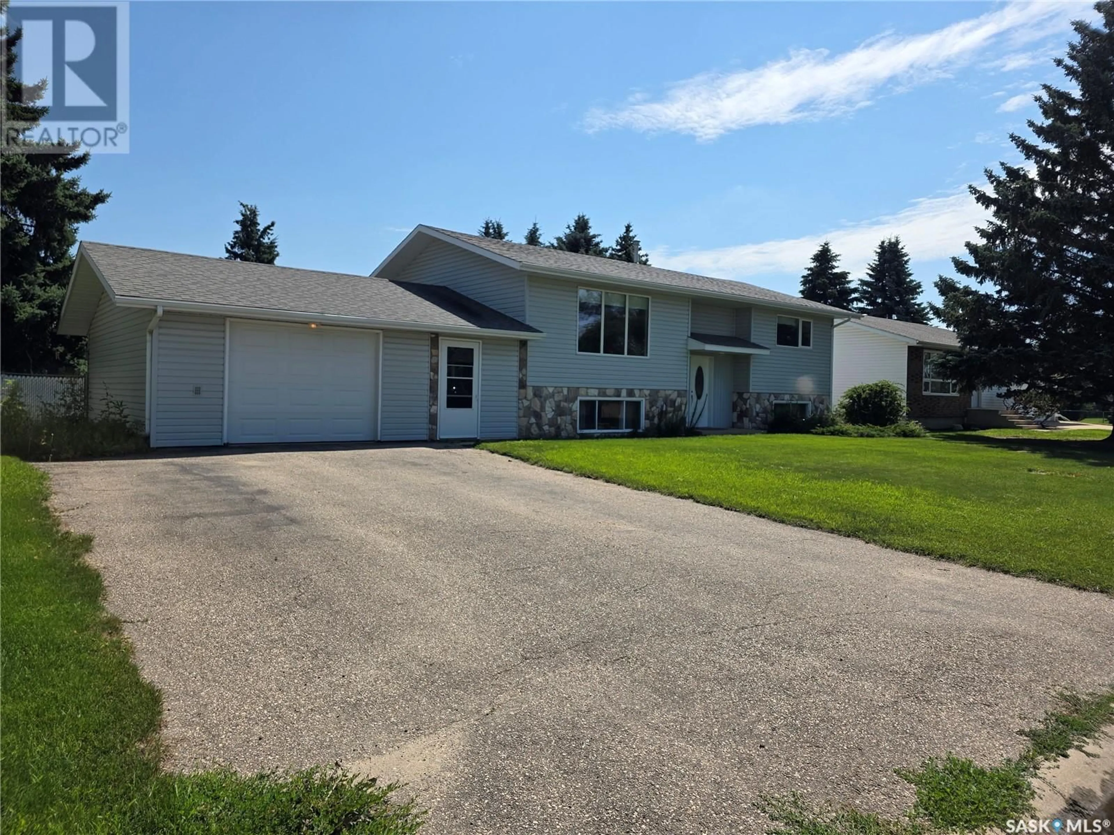 Home with vinyl exterior material, street for 523 HEARN STREET, Outlook Saskatchewan S0L2N0