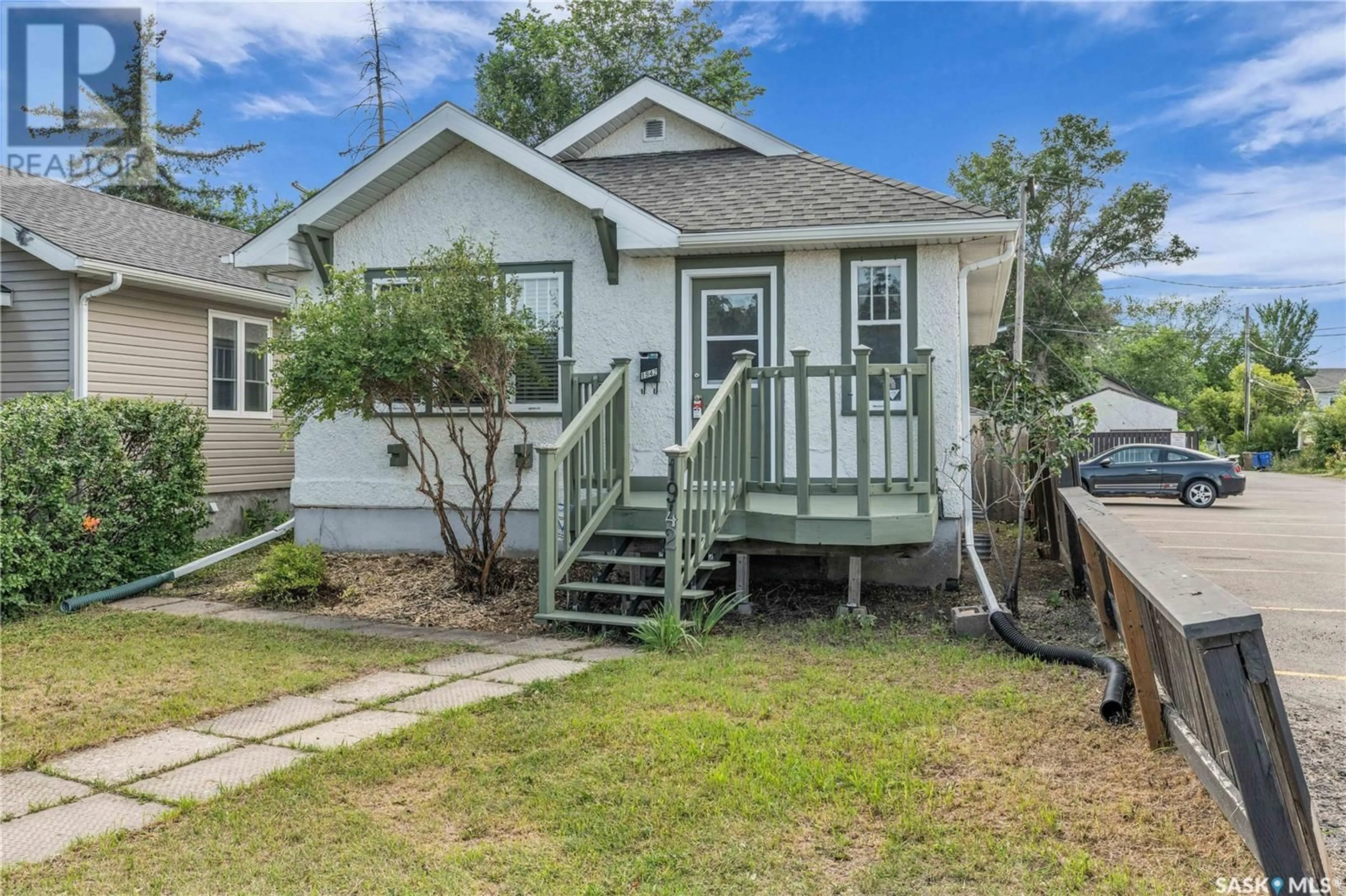 Home with vinyl exterior material, street for 1942 ELPHINSTONE STREET, Regina Saskatchewan S4T3N2