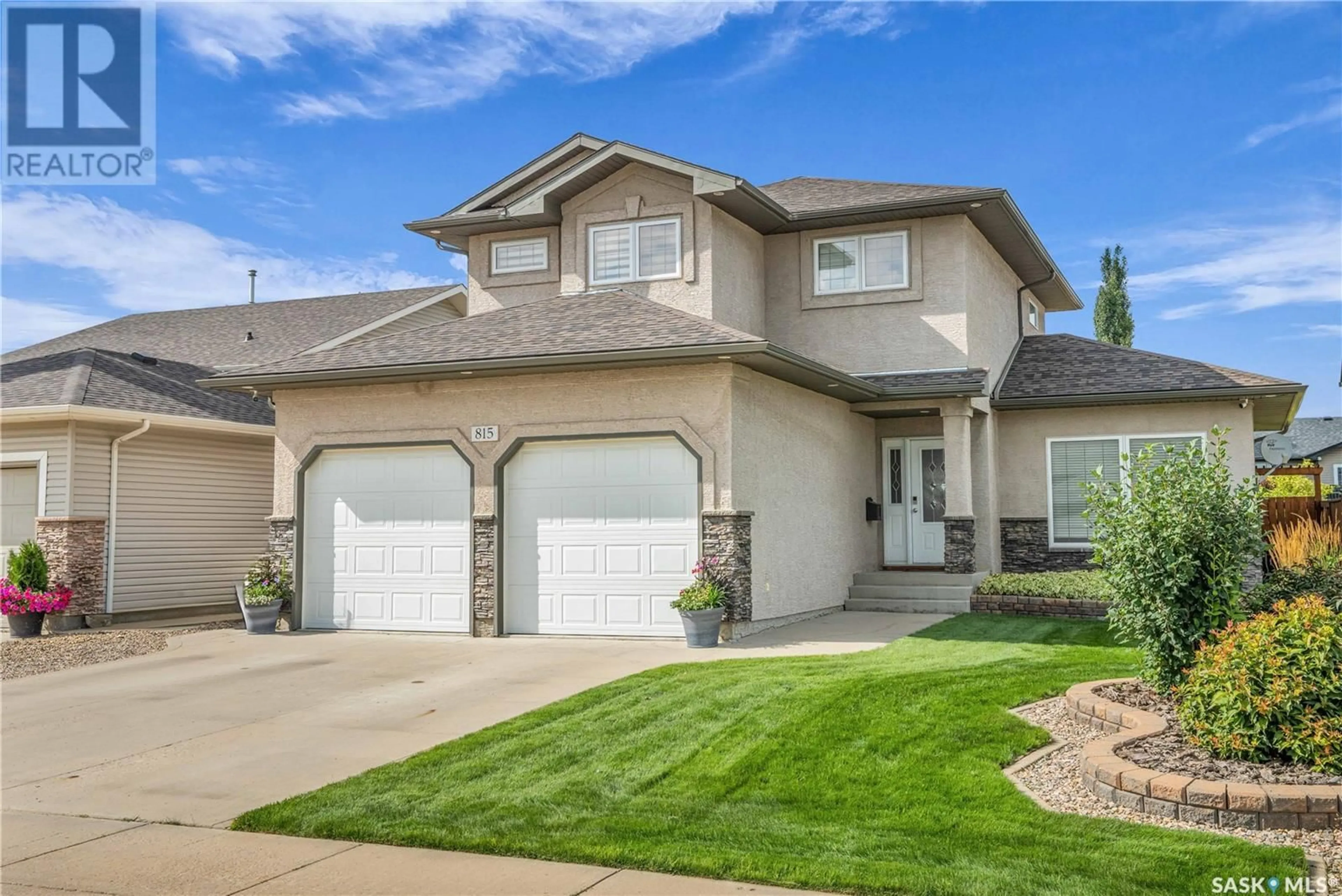 Home with vinyl exterior material, street for 815 COLUMBIA WAY, Martensville Saskatchewan S0K0A2