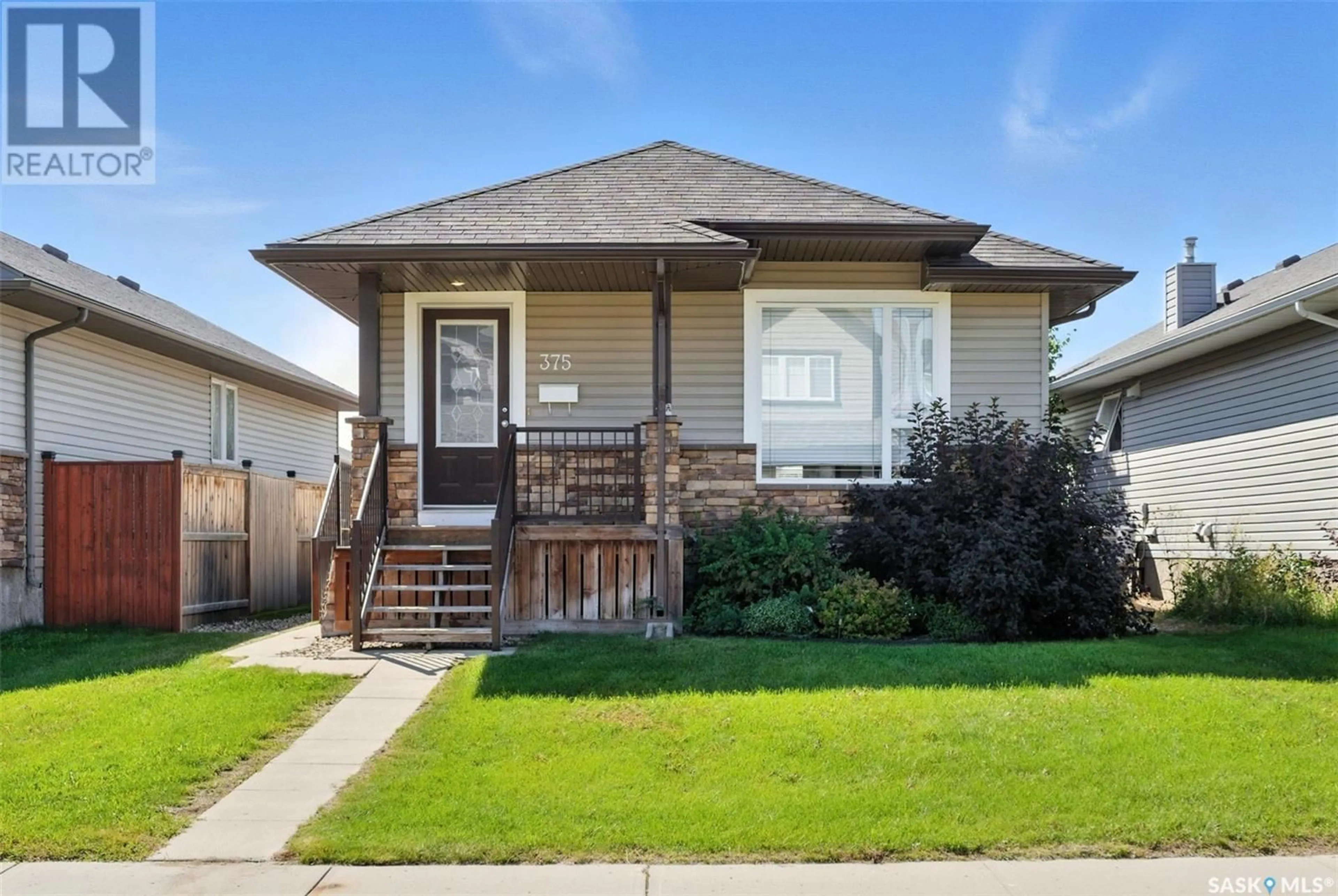 Home with vinyl exterior material, street for 375 LEVALLEY COVE, Saskatoon Saskatchewan S7T0H5