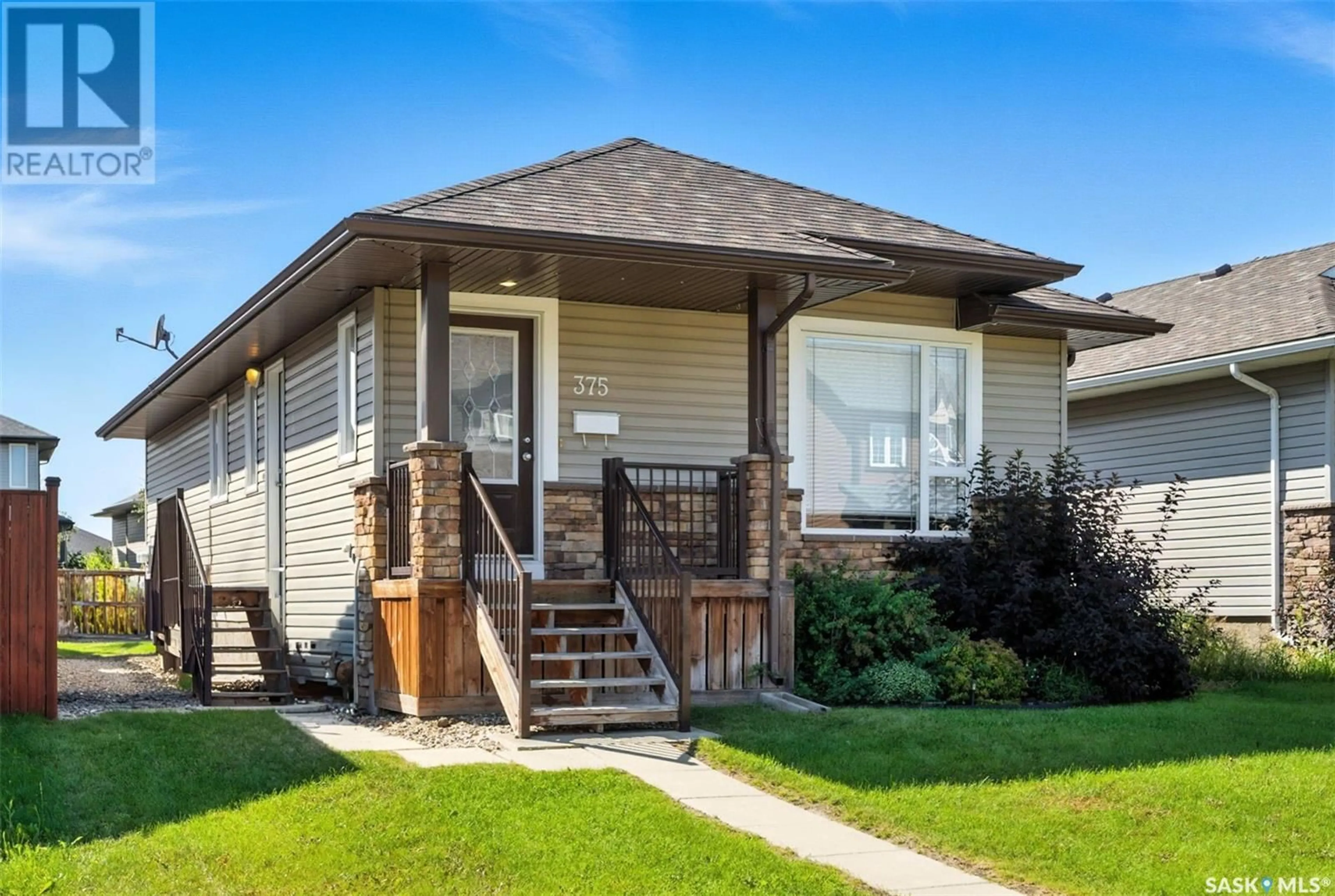 Home with vinyl exterior material, street for 375 LEVALLEY COVE, Saskatoon Saskatchewan S7T0H5