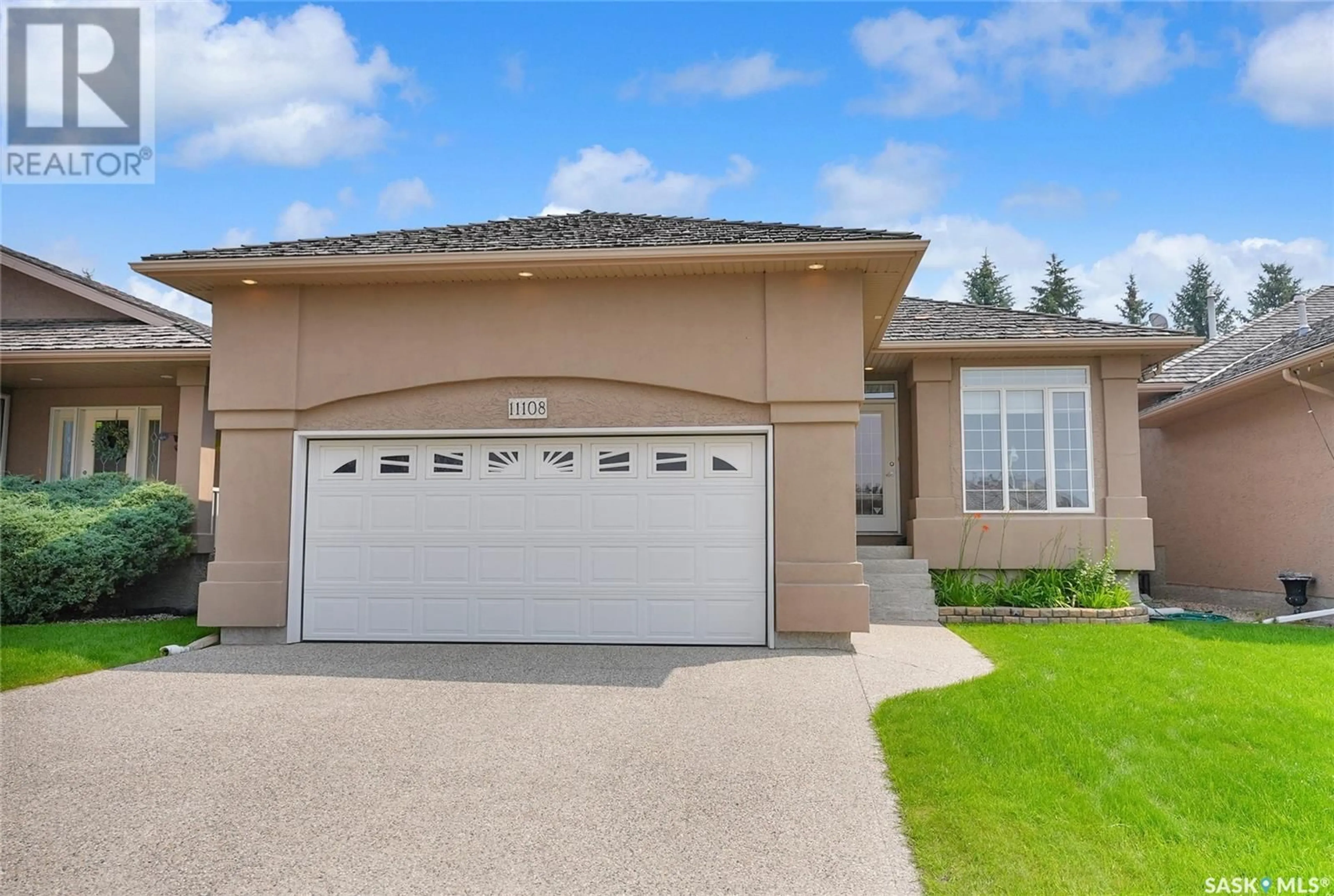 Home with vinyl exterior material, street for 11108 WASCANA MEADOWS, Regina Saskatchewan S4V2W7