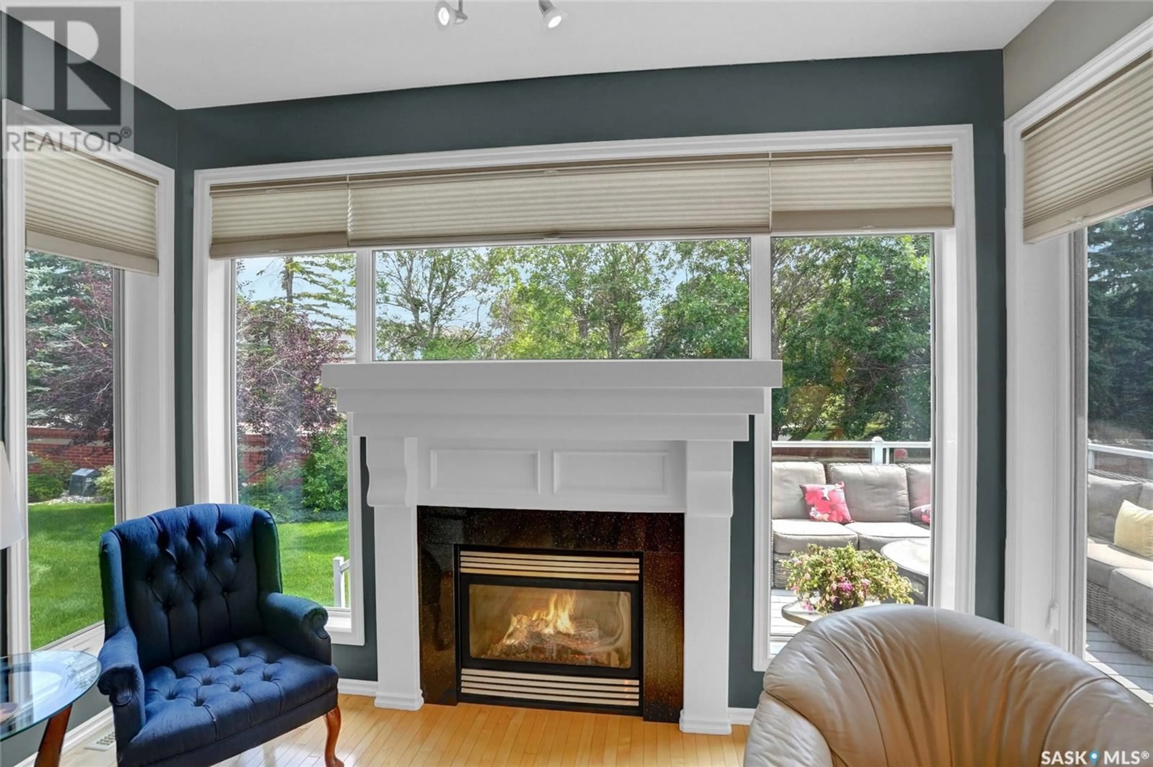 Living room with furniture, wood/laminate floor for 11108 WASCANA MEADOWS, Regina Saskatchewan S4V2W7