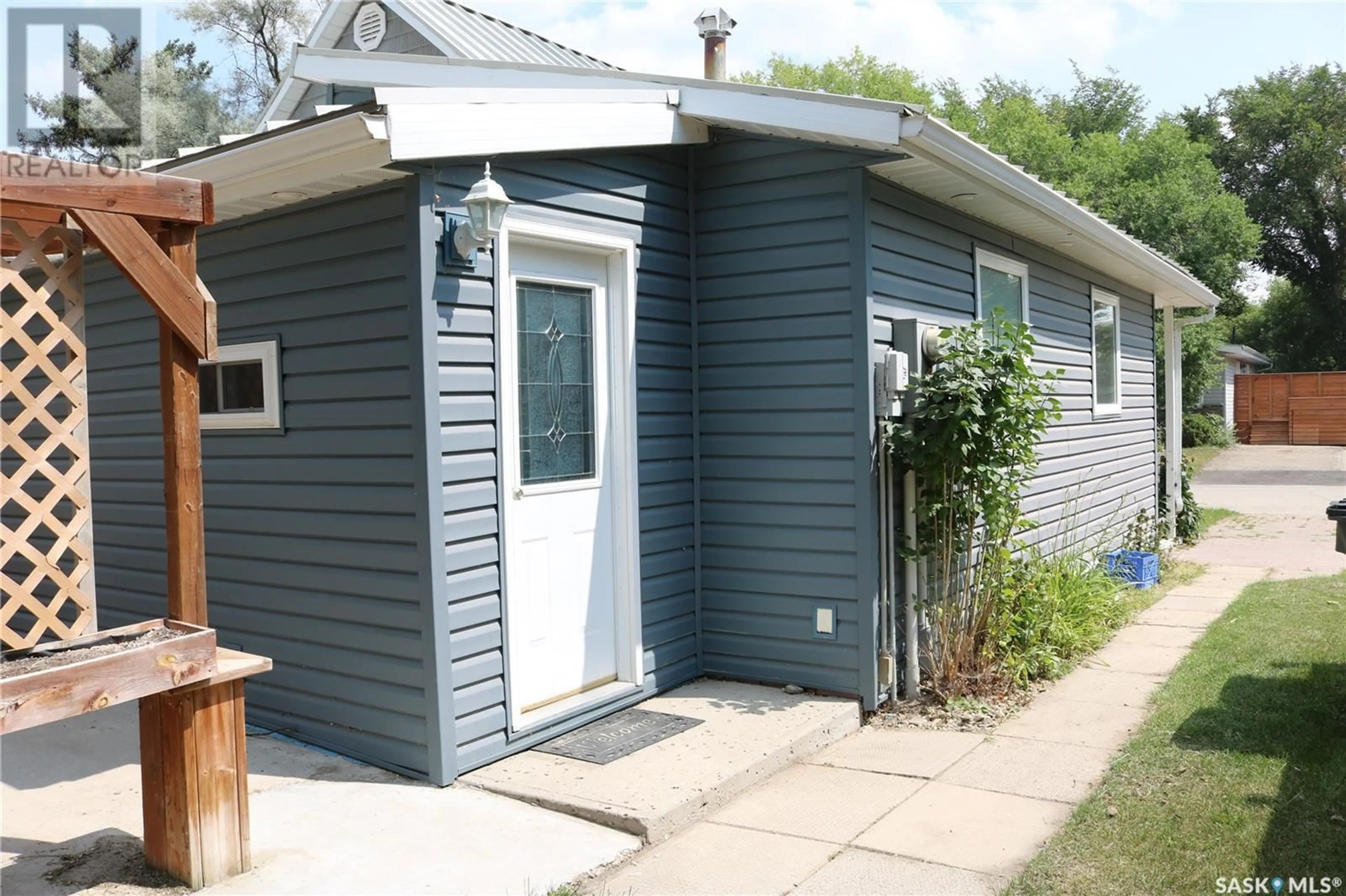 Home with vinyl exterior material, street for 704 OGILVIE STREET, Moosomin Saskatchewan S0G3N0