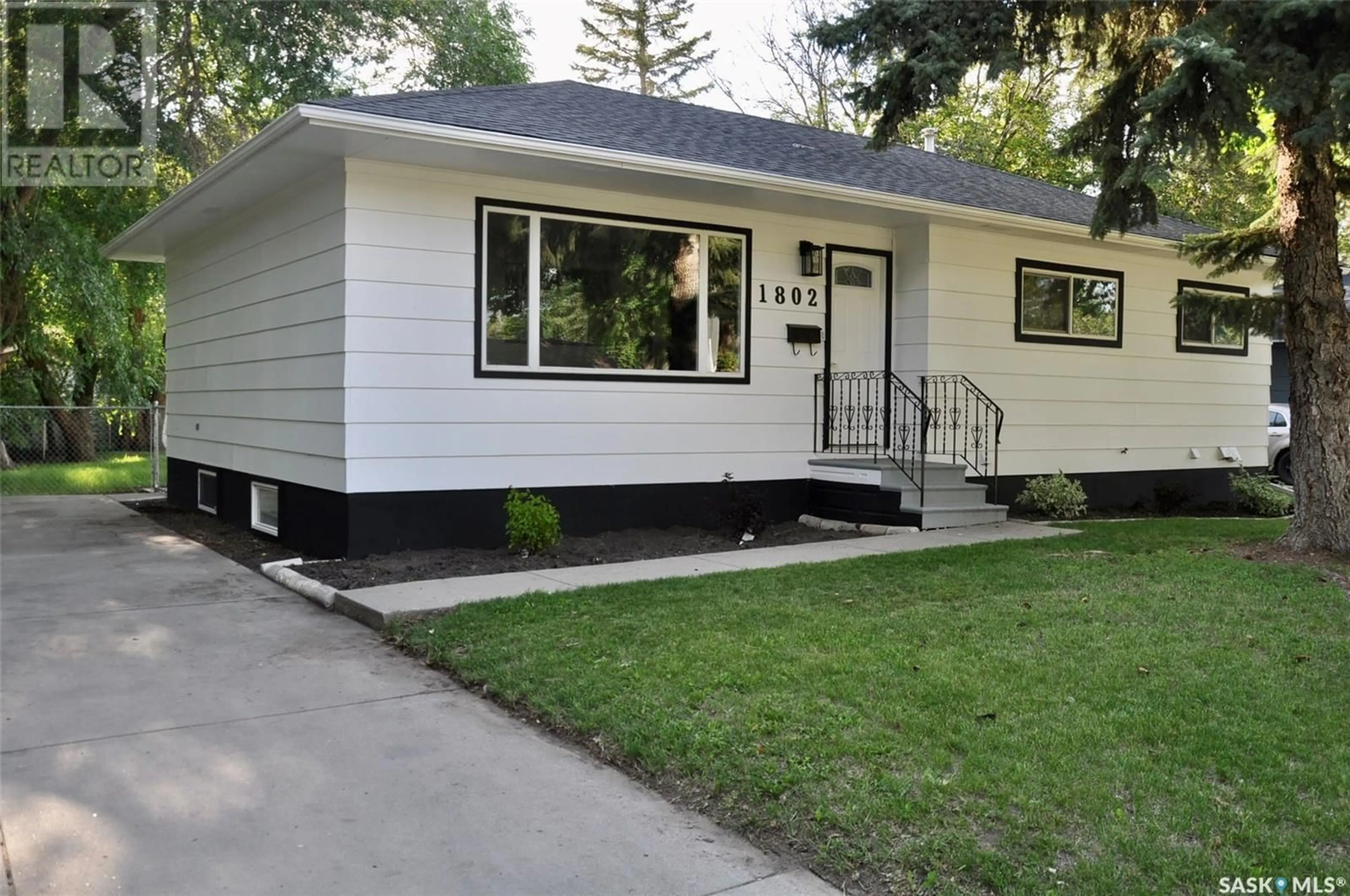 Home with vinyl exterior material, street for S - 1802 PRESTON AVENUE, Saskatoon Saskatchewan S7H2V8
