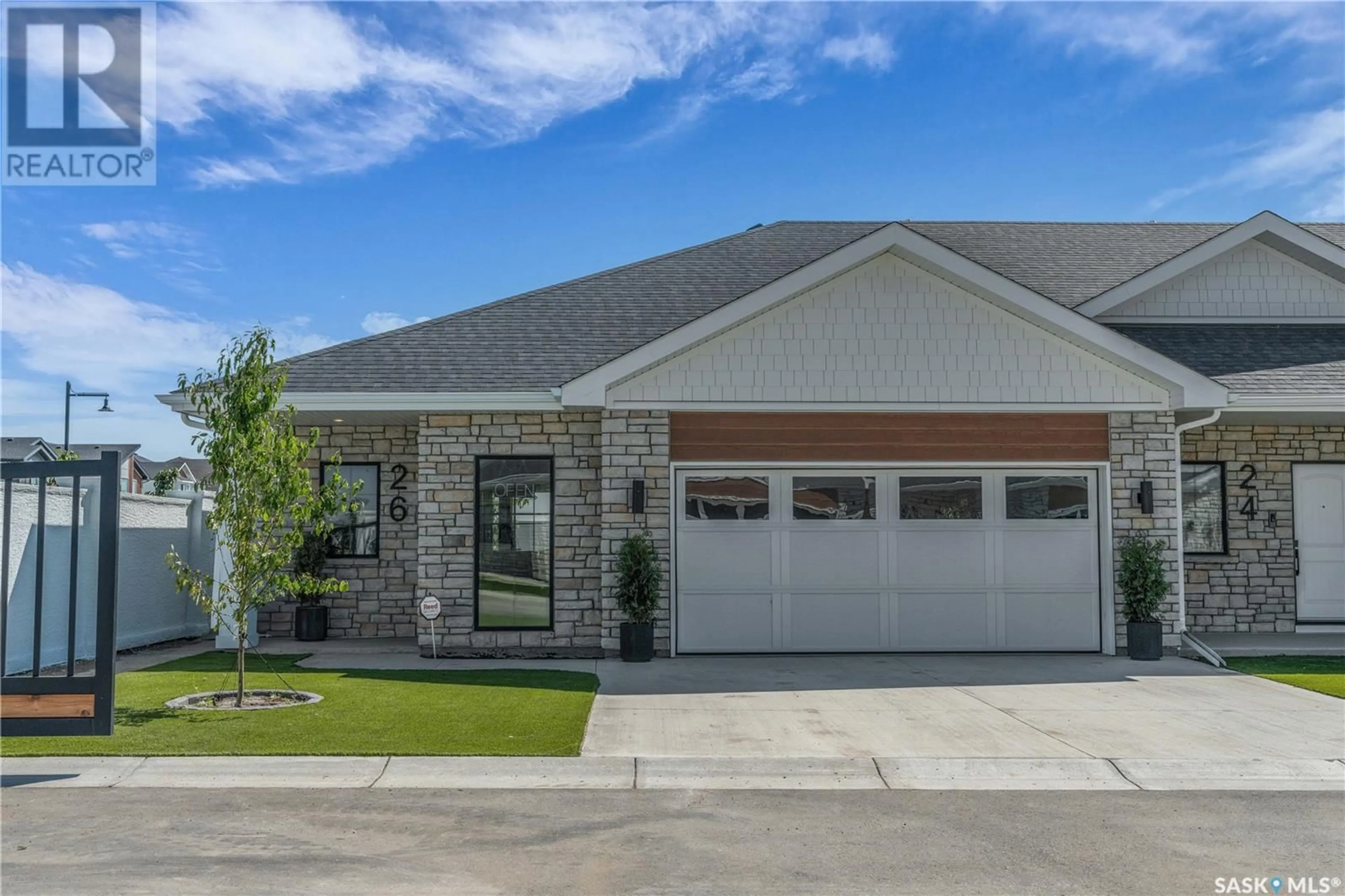 Home with brick exterior material, street for 4 720 BRIGHTON BOULEVARD, Saskatoon Saskatchewan S7V1X1