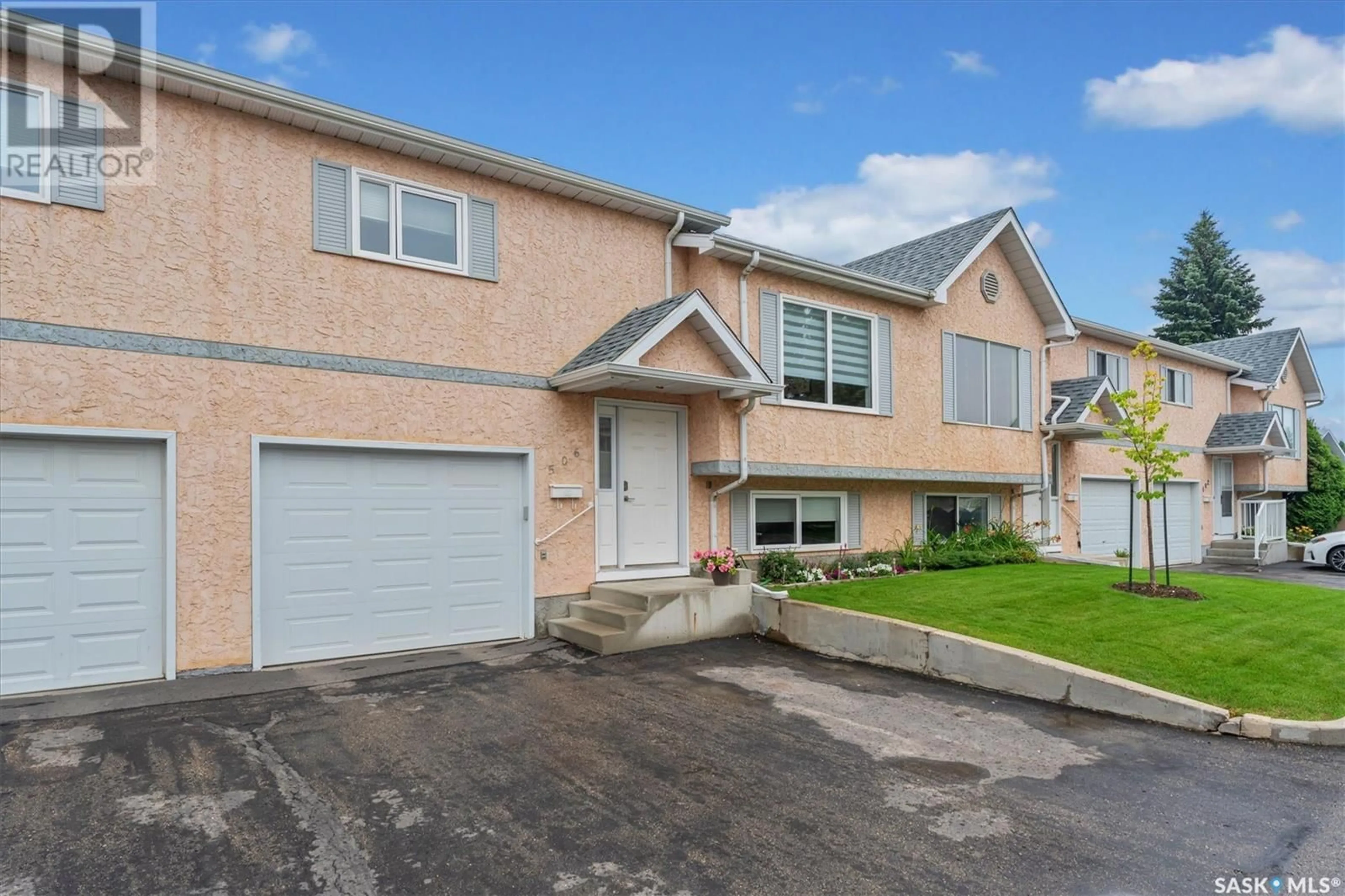 Home with vinyl exterior material, street for 506 510 PEREHUDOFF CRESCENT, Saskatoon Saskatchewan S7N4H6