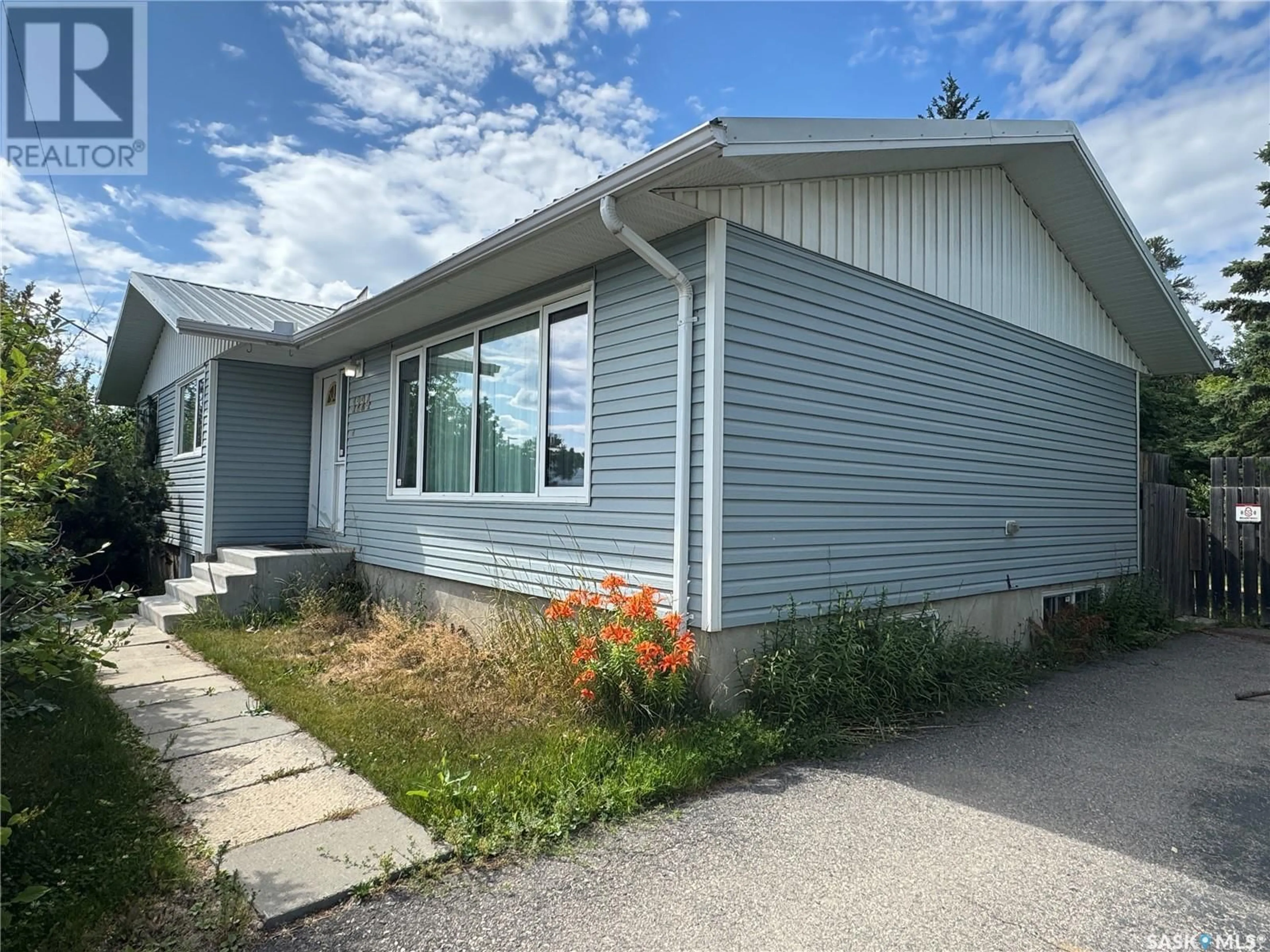 Home with vinyl exterior material, street for 1224 SCHOOL AVENUE, La Ronge Saskatchewan S0J1L0