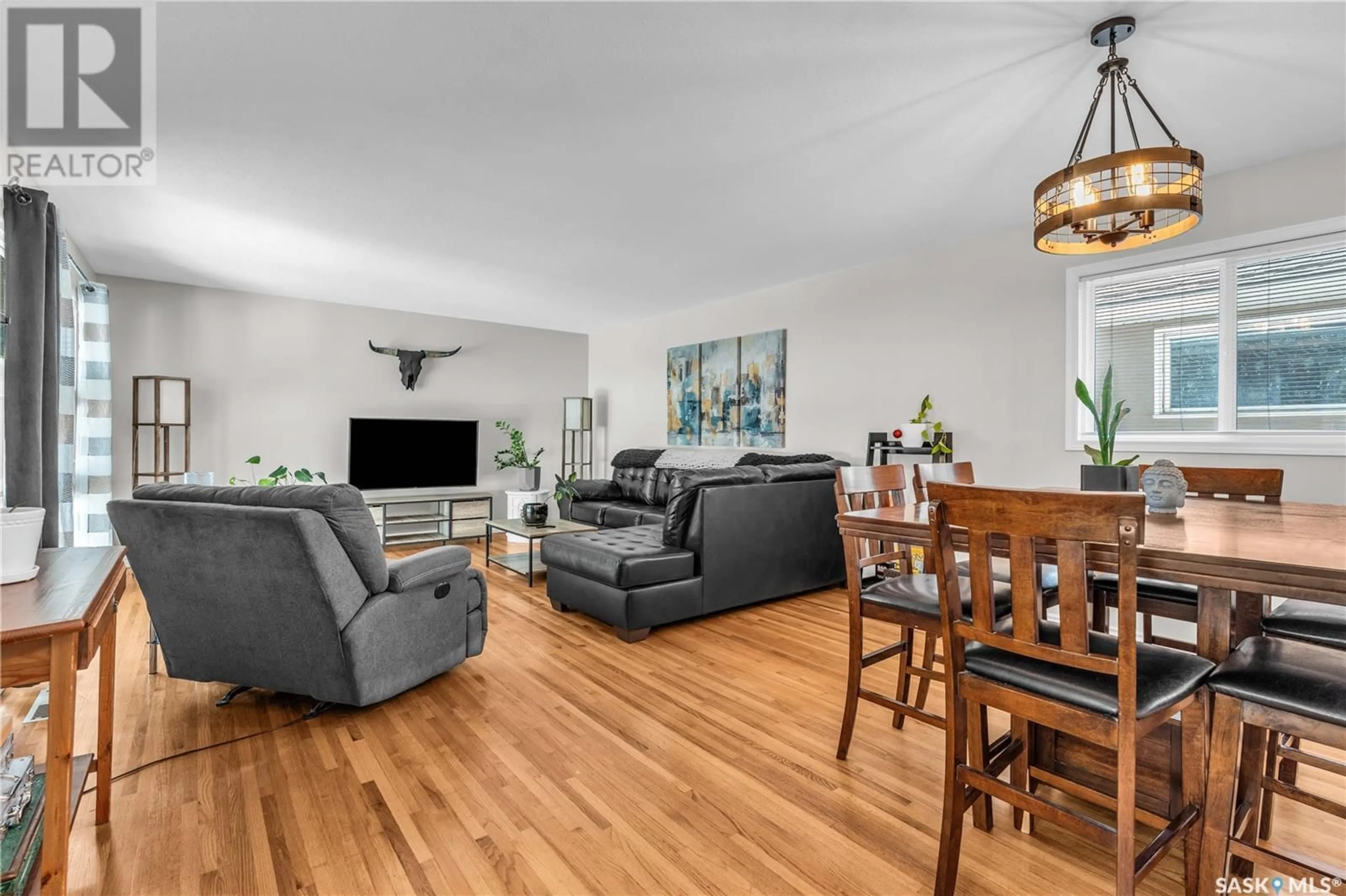 Living room with furniture, wood/laminate floor for 1602 PARK AVENUE, Saskatoon Saskatchewan S7H2P3