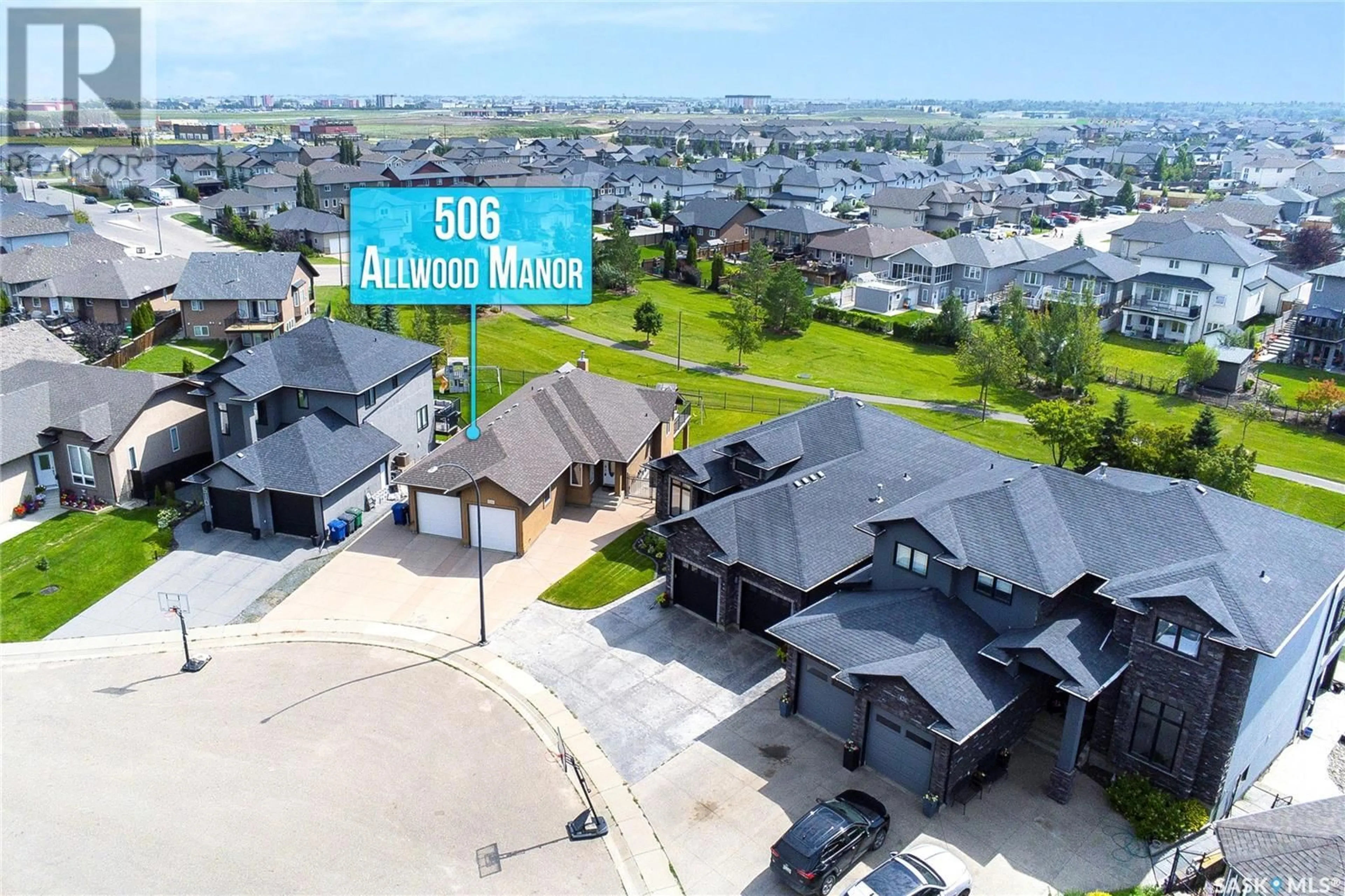 A pic from outside/outdoor area/front of a property/back of a property/a pic from drone, unknown for 506 ALLWOOD MANOR, Saskatoon Saskatchewan S7R0A4