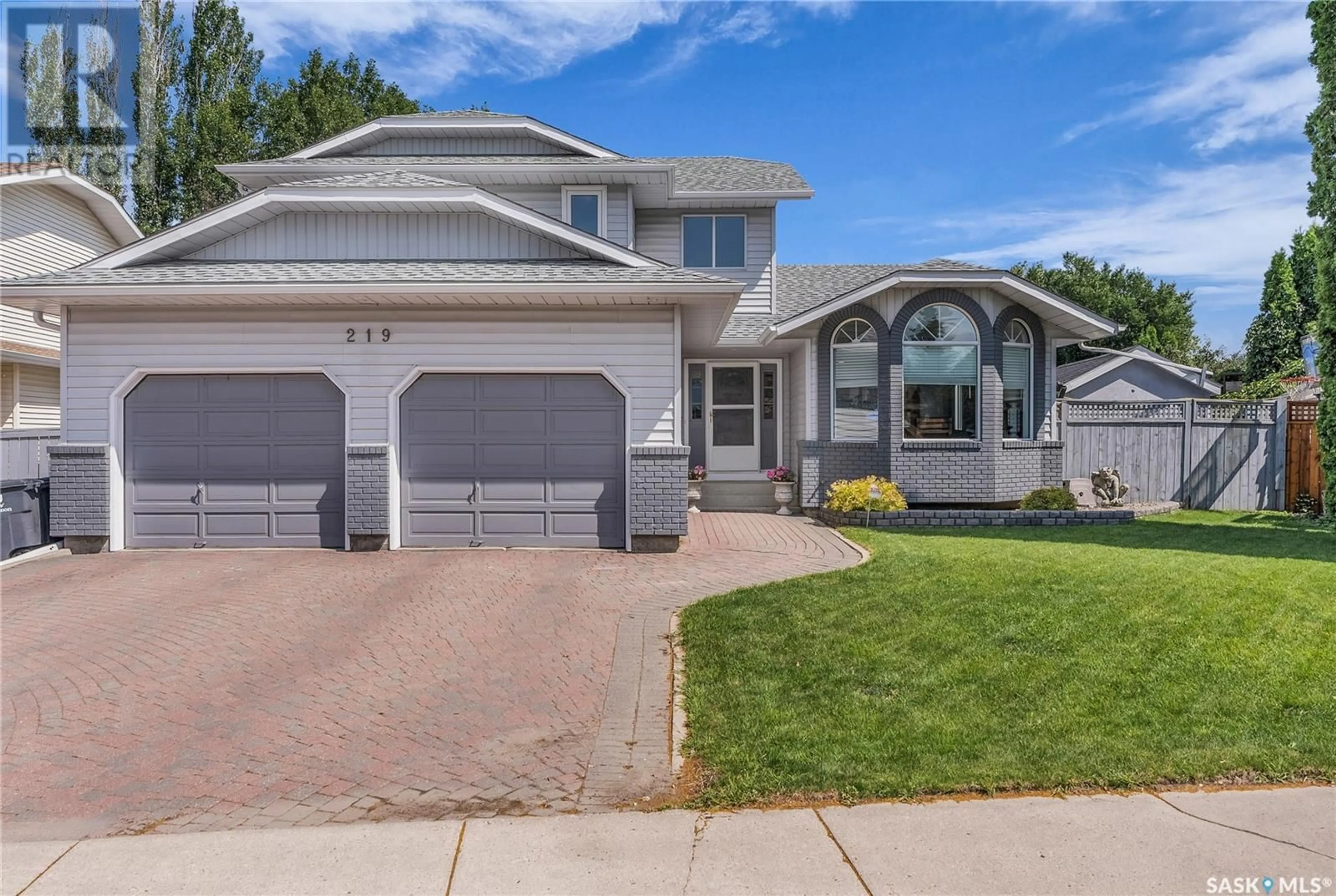 Home with vinyl exterior material, street for 219 NESSLIN TERRACE, Saskatoon Saskatchewan S7J4S2