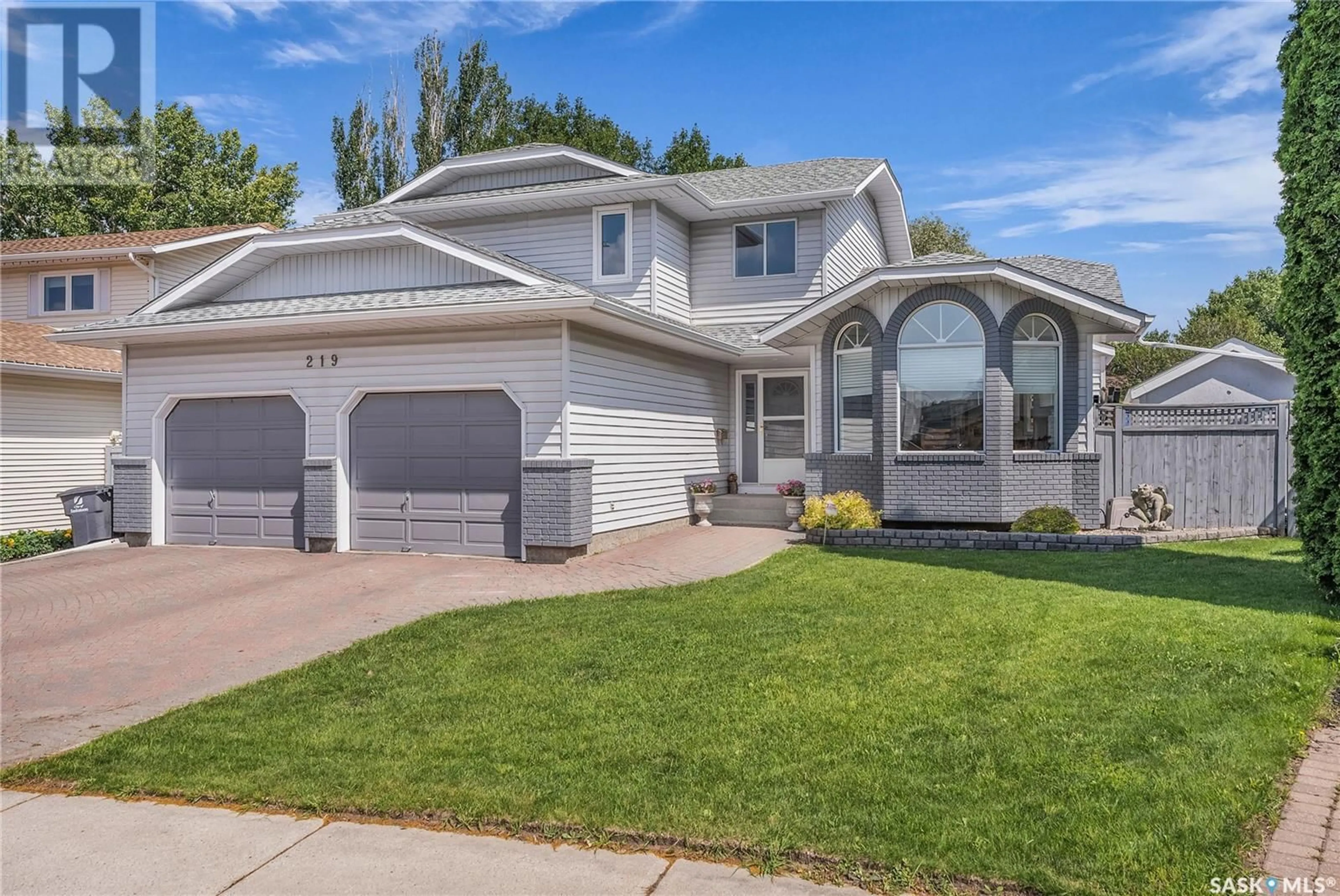 Home with vinyl exterior material, street for 219 NESSLIN TERRACE, Saskatoon Saskatchewan S7J4S2