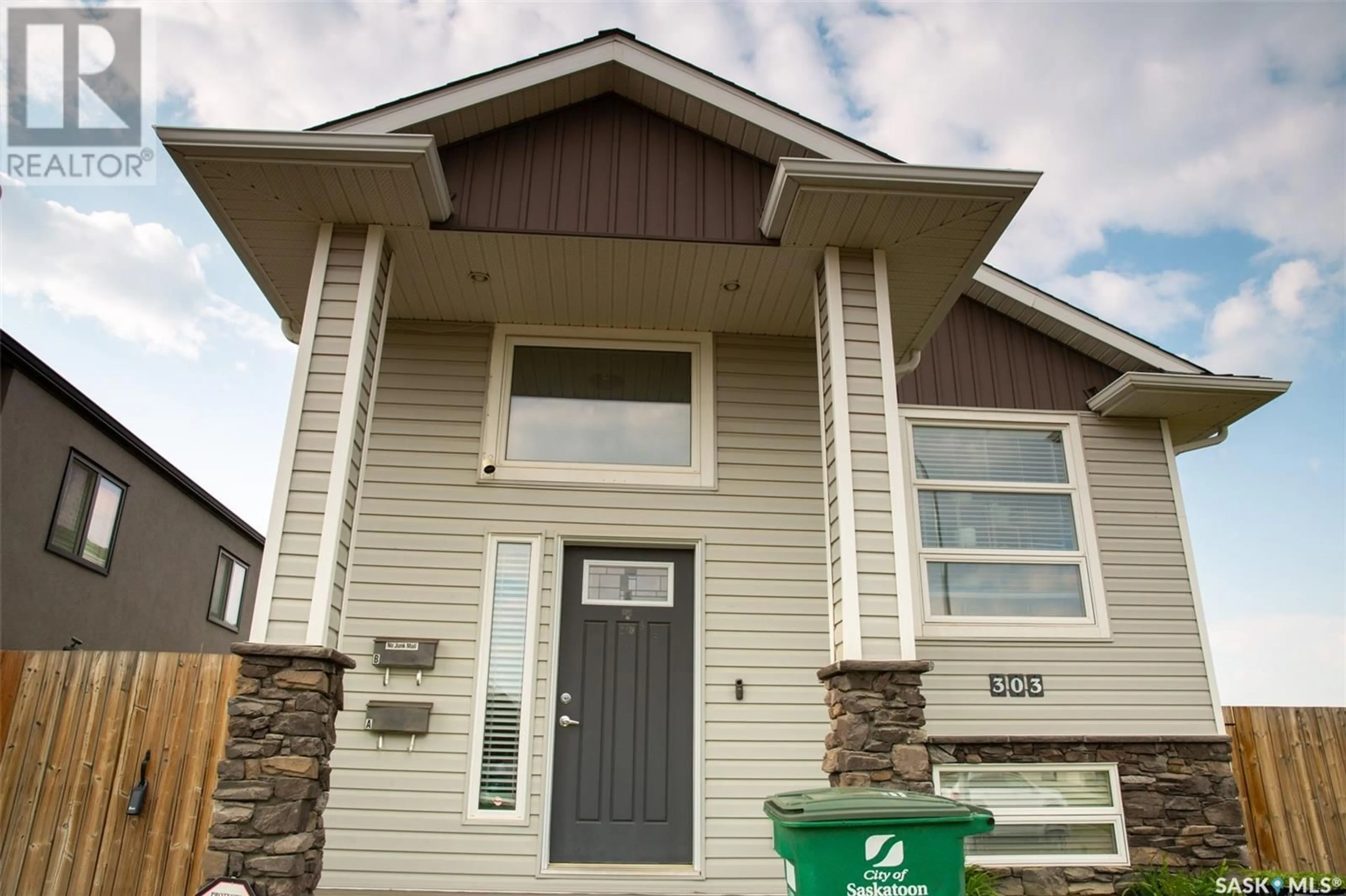 Home with vinyl exterior material, street for 303 ROSEWOOD BOULEVARD, Saskatoon Saskatchewan S7V0G8
