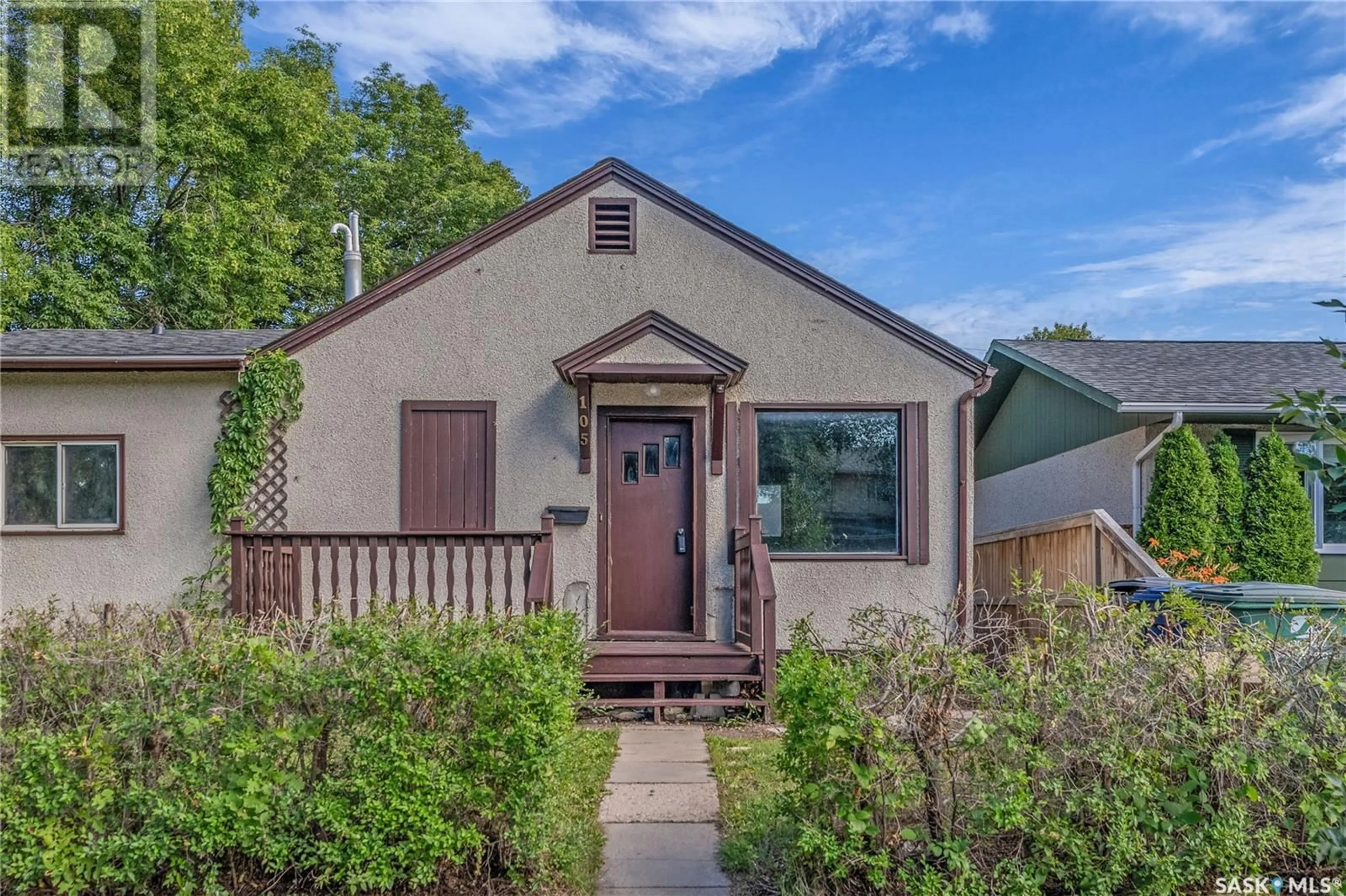 Home with vinyl exterior material, street for 105 DUNLOP STREET, Saskatoon Saskatchewan S7N2B6