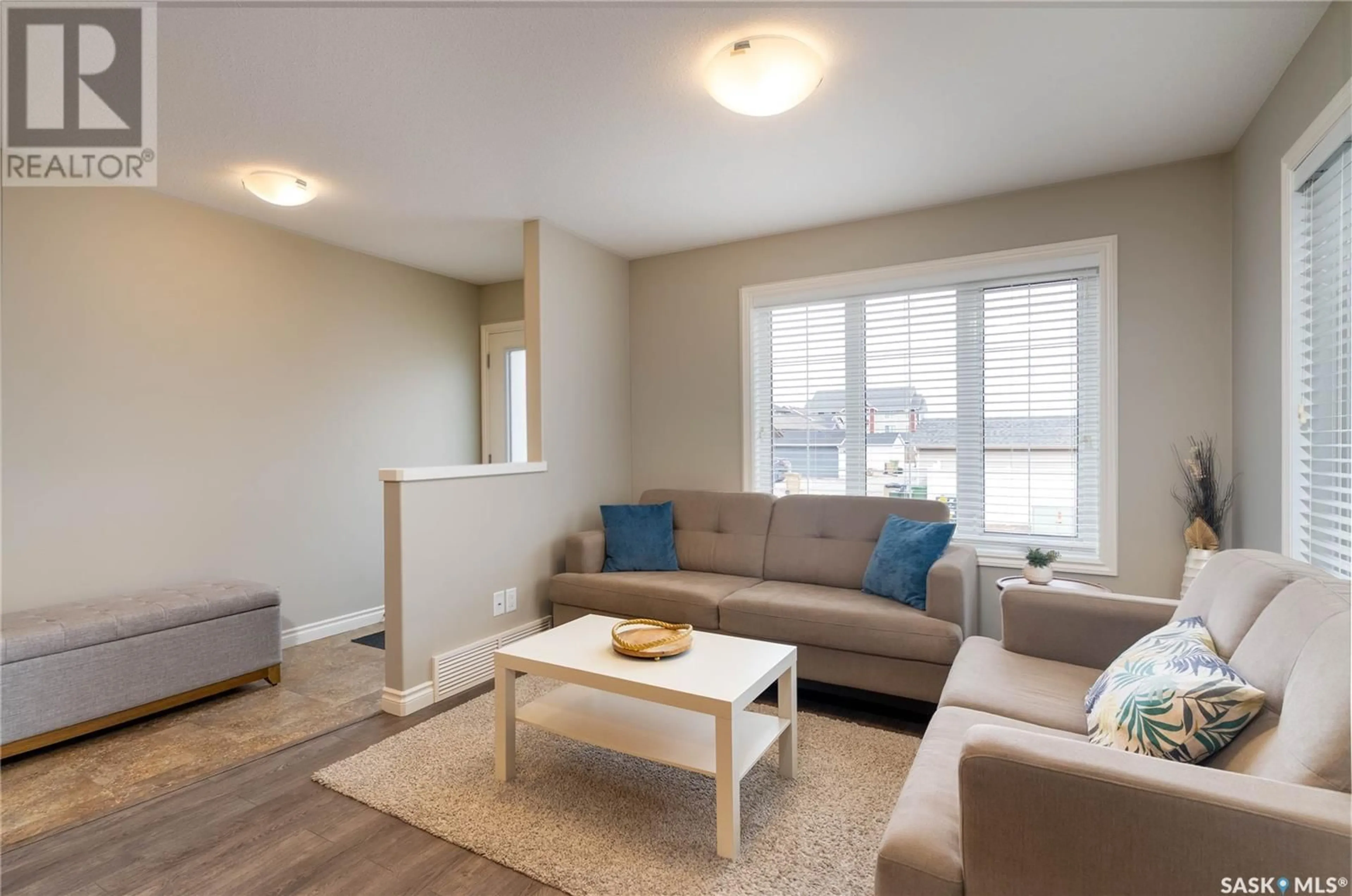 Living room with furniture, wood/laminate floor for 4330 SHAFFER STREET, Regina Saskatchewan S4W0L4