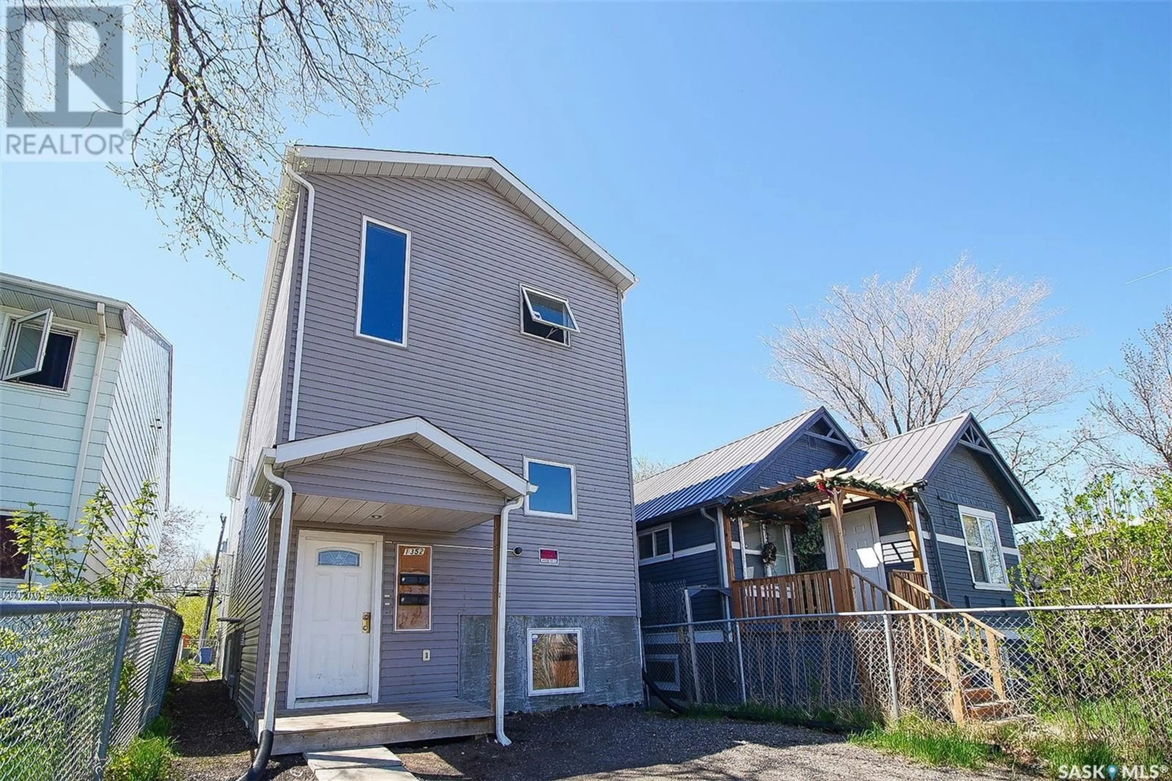 Home with vinyl exterior material, street for 1352 ANGUS STREET, Regina Saskatchewan S4T1Y8