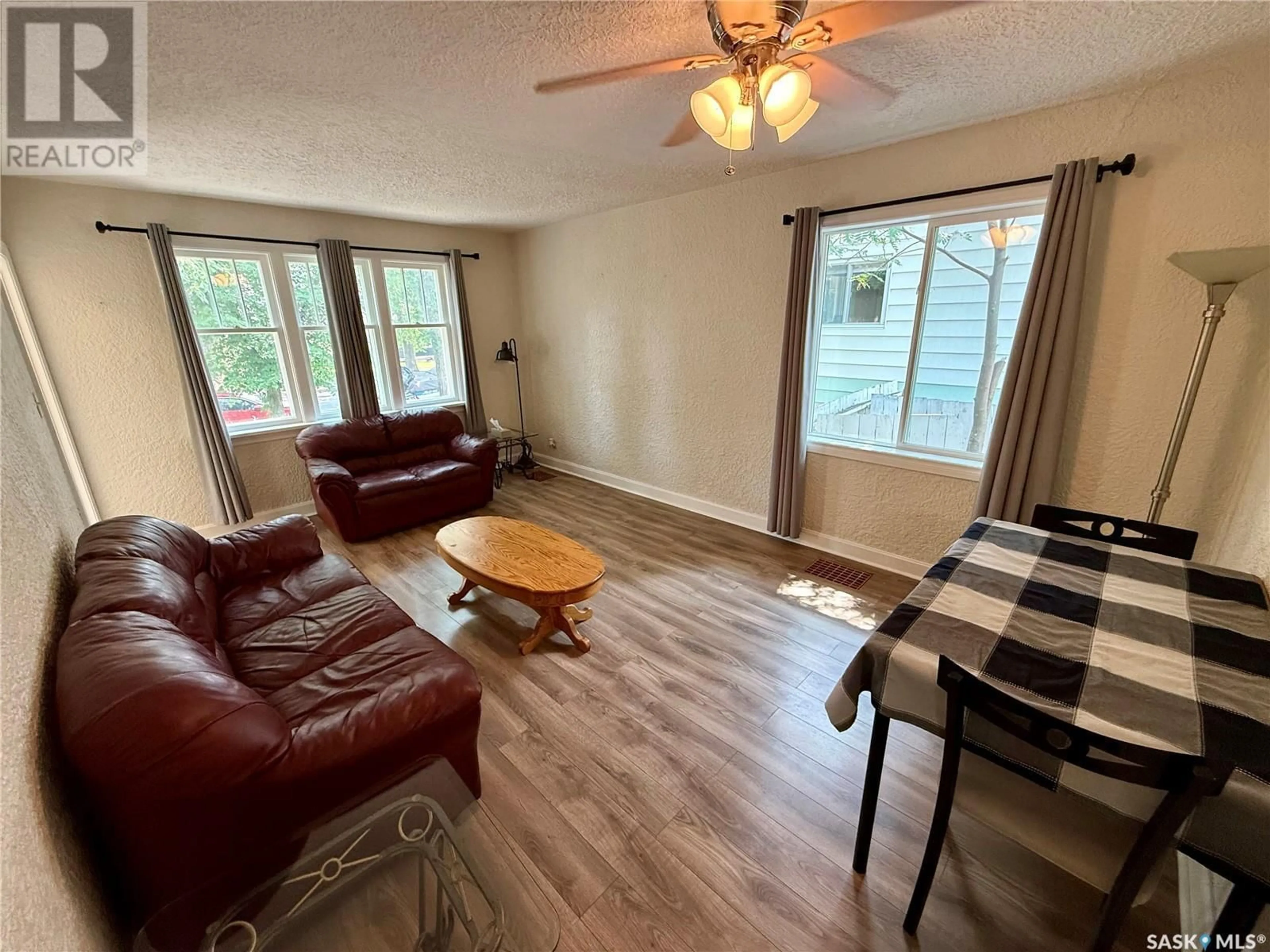 Living room with furniture, wood/laminate floor for 2734 WALLACE STREET, Regina Saskatchewan S4N4B2