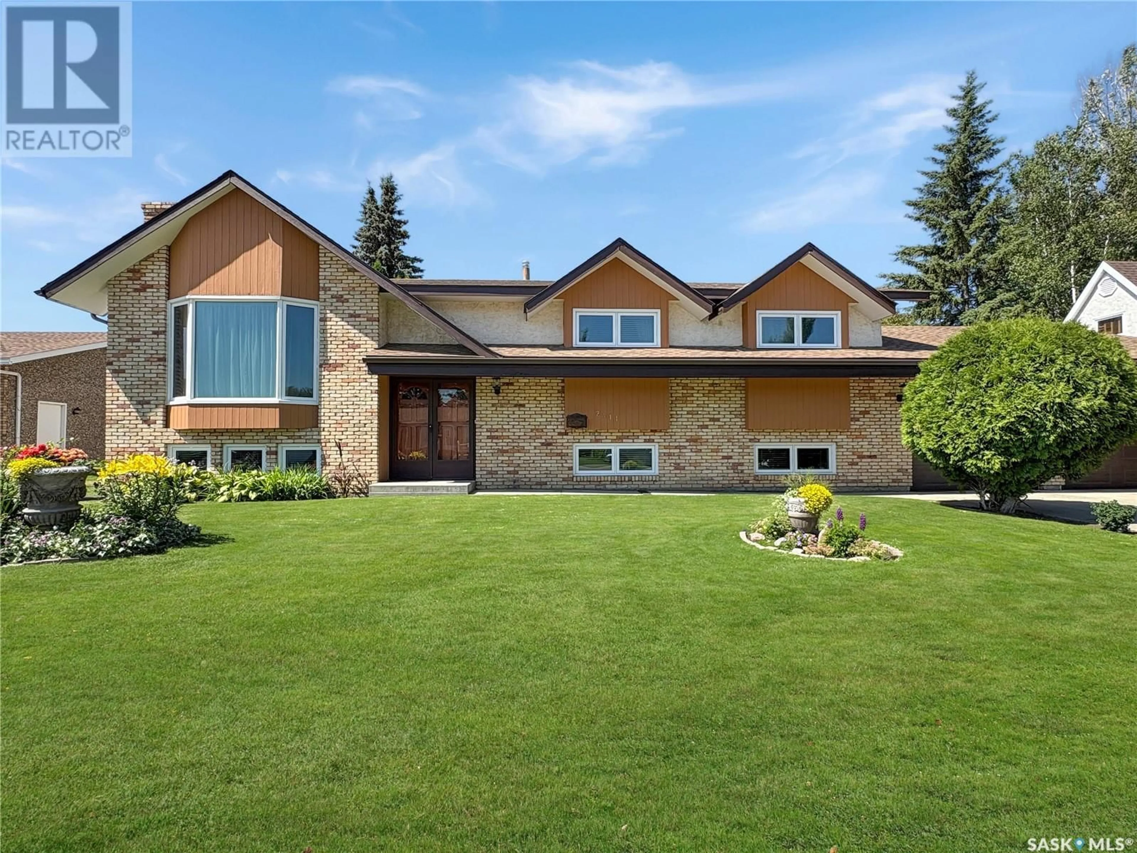 Home with brick exterior material, mountain view for 2411 MEADOW LARK LANE, North Battleford Saskatchewan S9A3V1