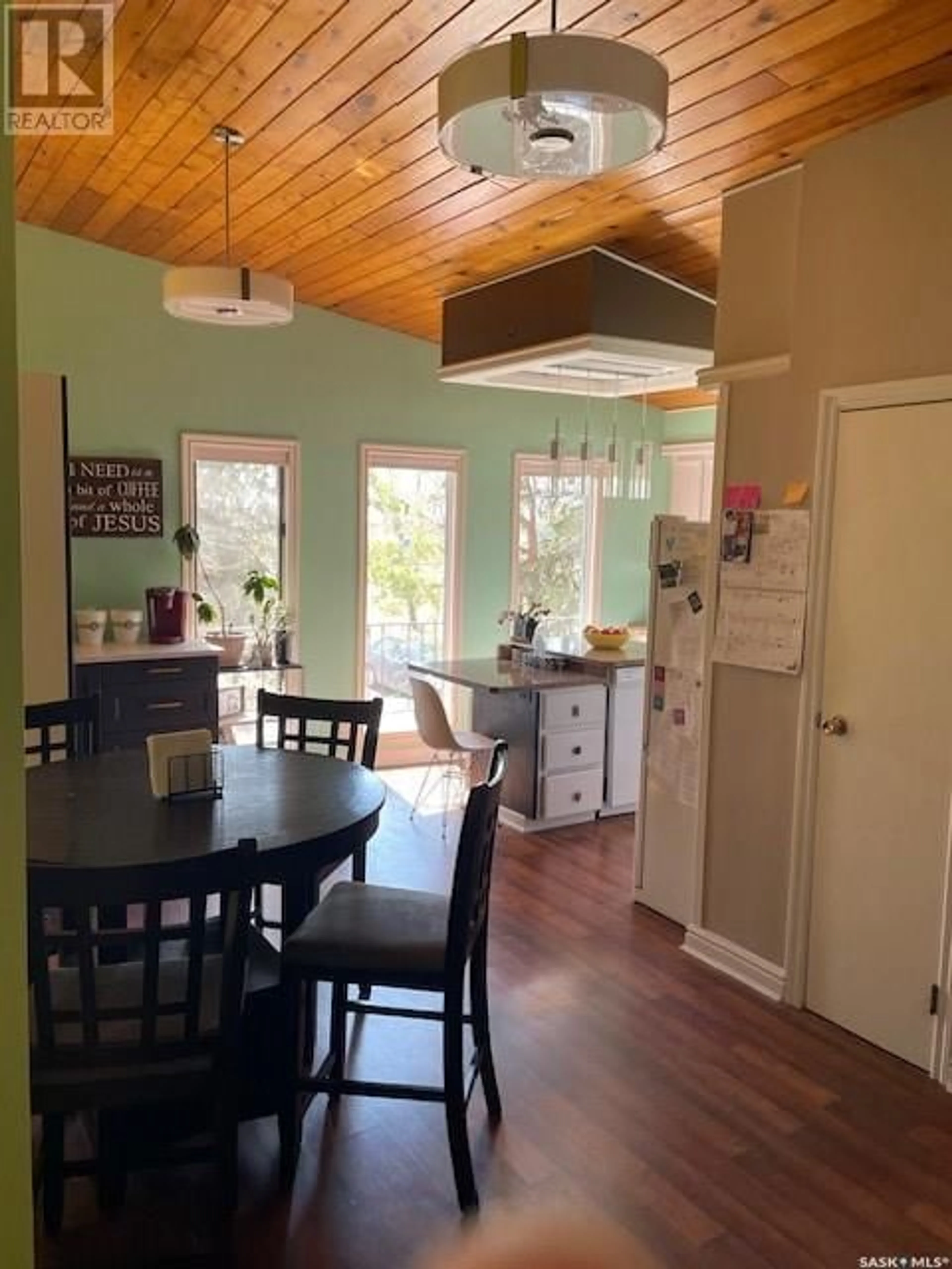 Open concept kitchen, wood/laminate floor for 8008 7TH STREET, Rosthern Saskatchewan S0K3R0