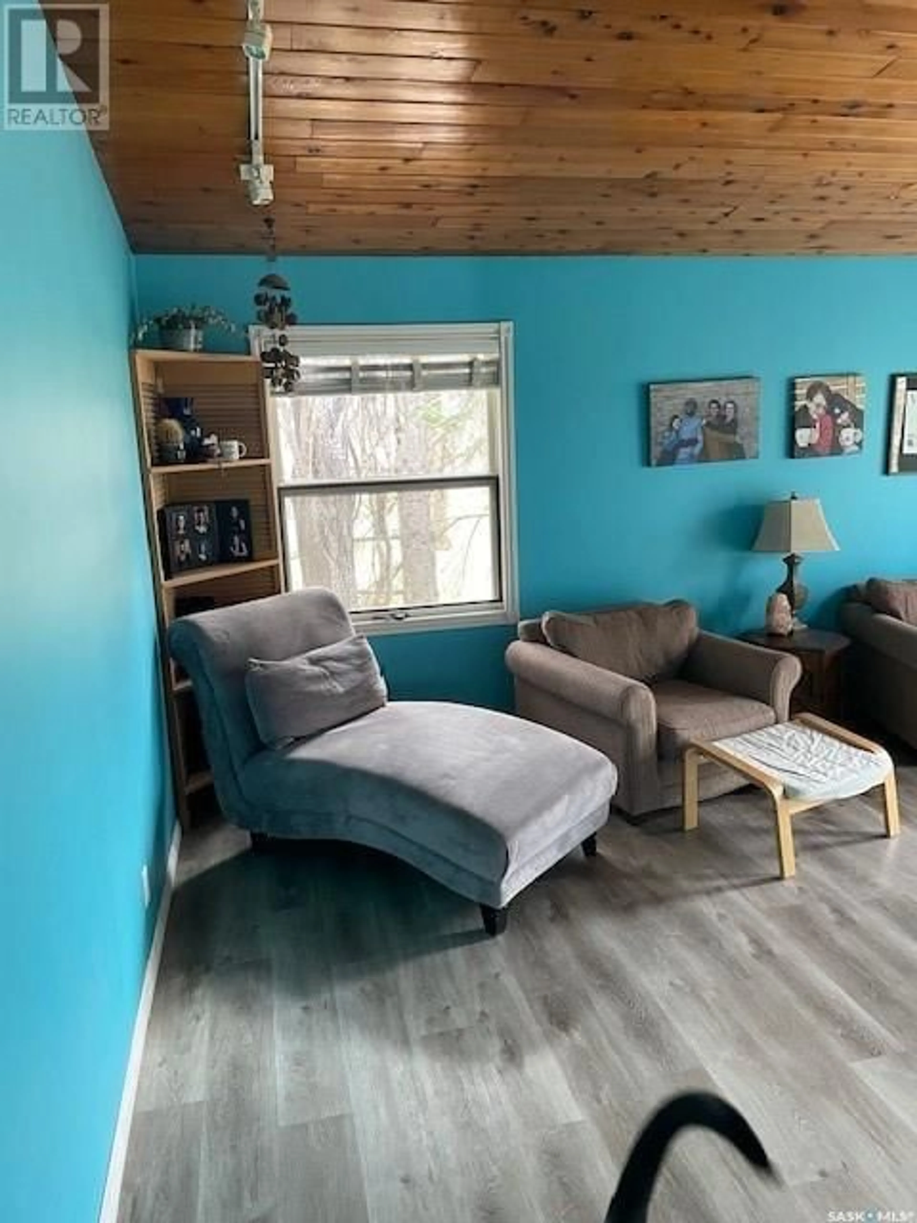 Living room with furniture, wood/laminate floor for 8008 7TH STREET, Rosthern Saskatchewan S0K3R0