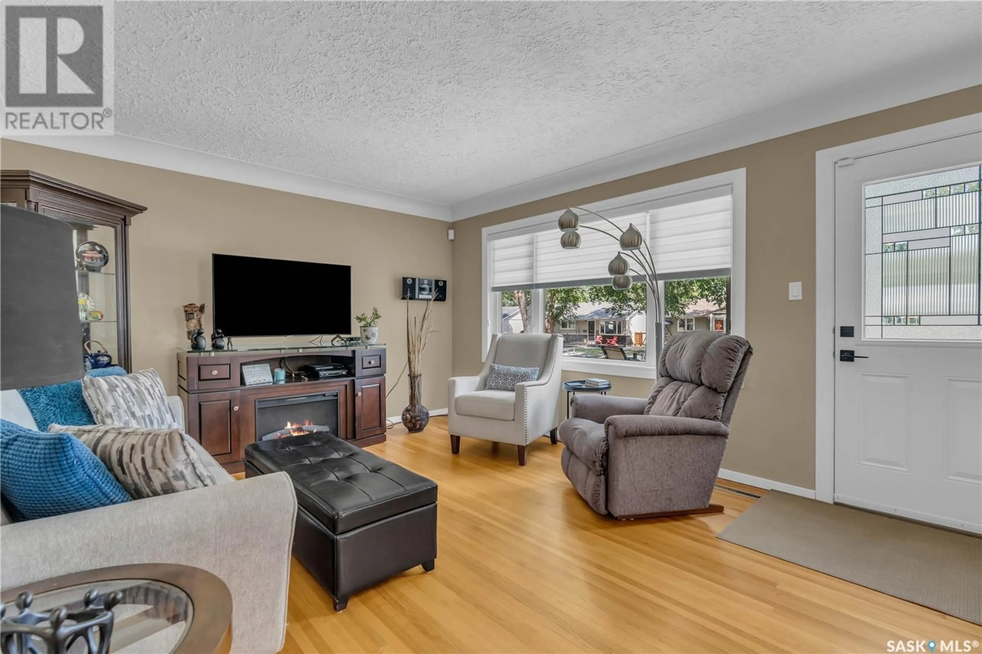 Living room with furniture, wood/laminate floor for 2738 BORDEN STREET, Regina Saskatchewan S4N2L1