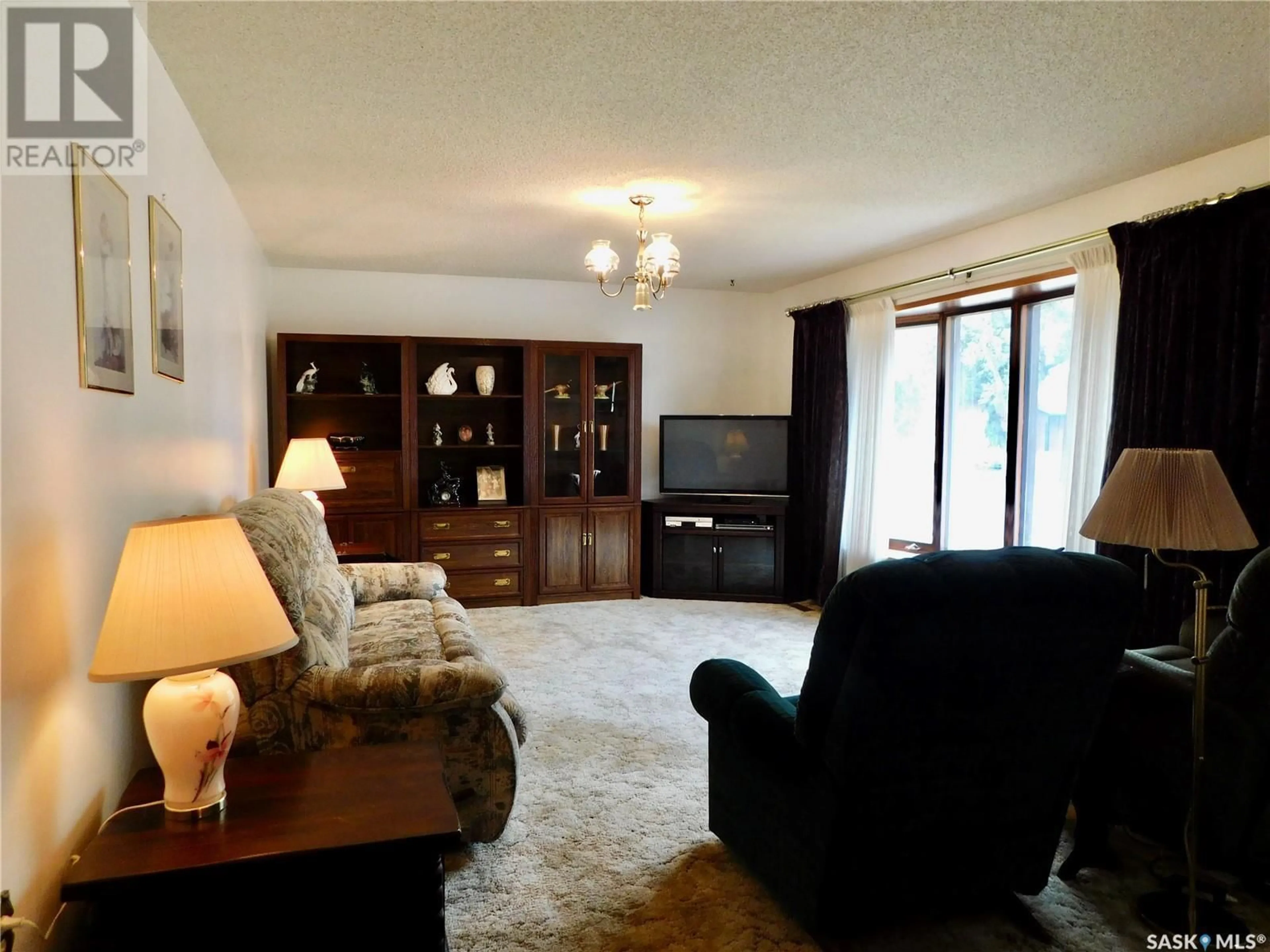 Living room with furniture, unknown for 217 5TH AVENUE, Assiniboia Saskatchewan S0H0B0