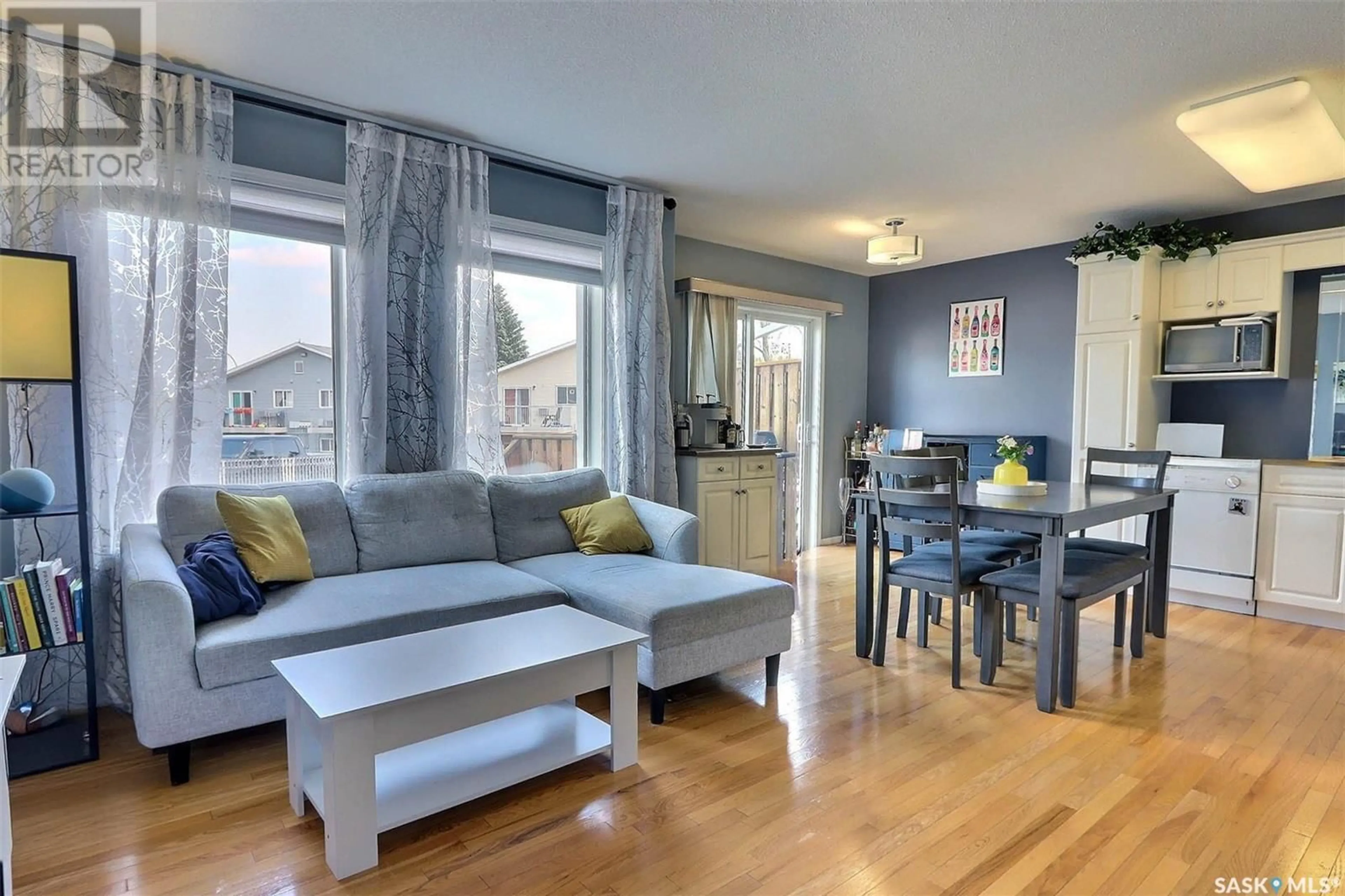 Living room with furniture, wood/laminate floor for 16 - 1620 OLIVE DIEFENBAKER DRIVE, Prince Albert Saskatchewan S6V1C5