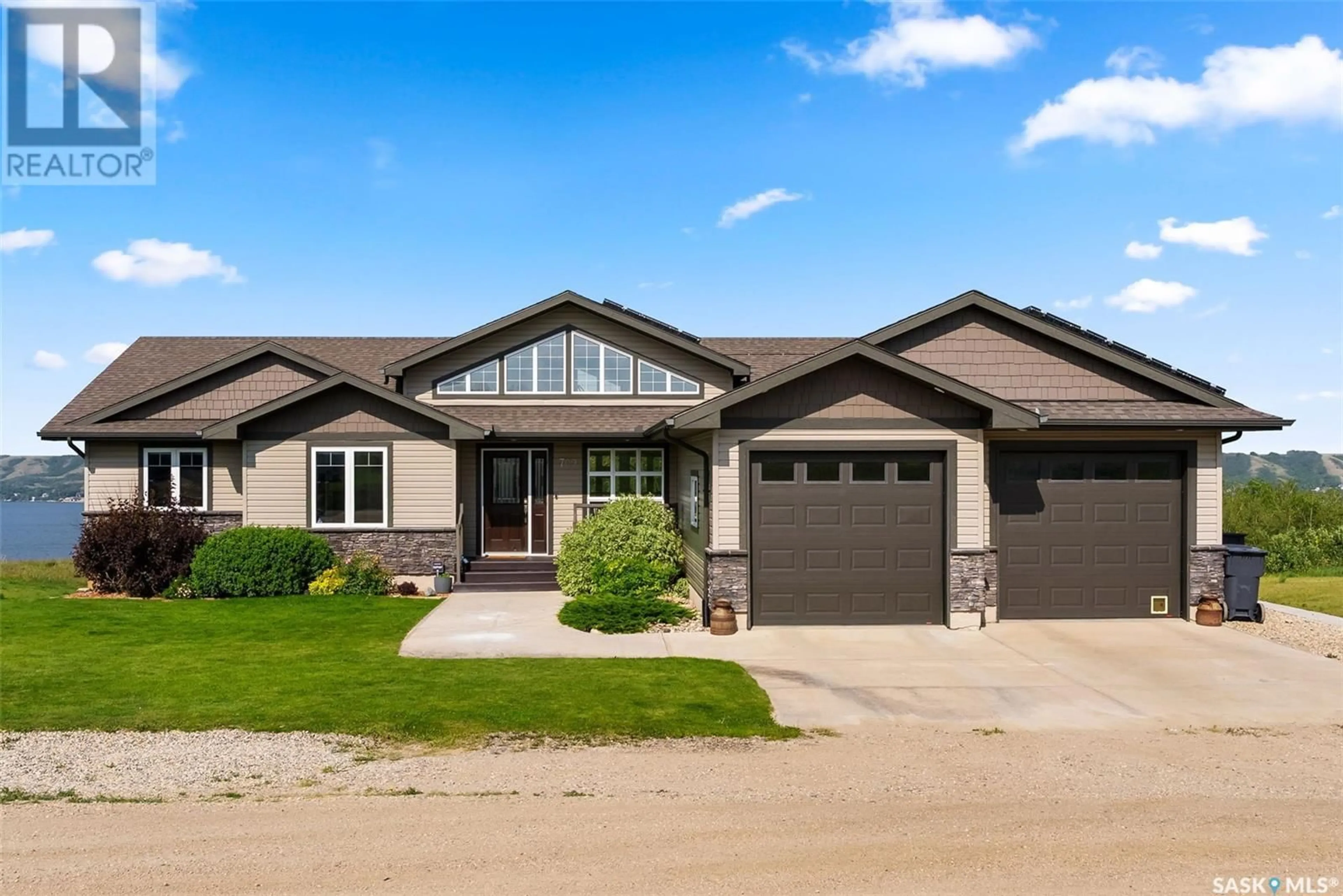 Home with brick exterior material, street for 709 SASKATOON DRIVE, Katepwa Beach Saskatchewan S0G1S0