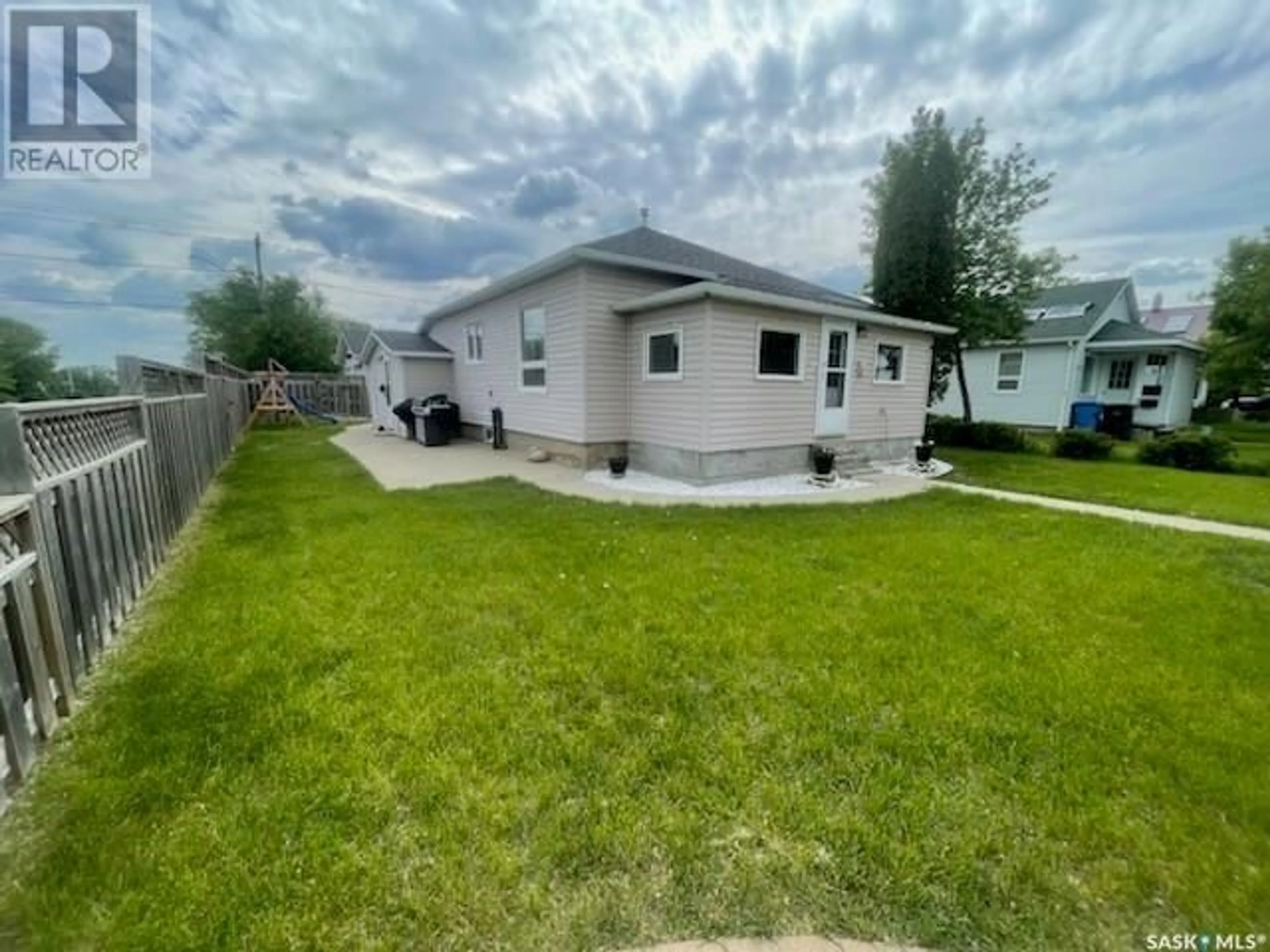 A pic from outside/outdoor area/front of a property/back of a property/a pic from drone, street for 1002 2ND STREET, Estevan Saskatchewan S4A0L7