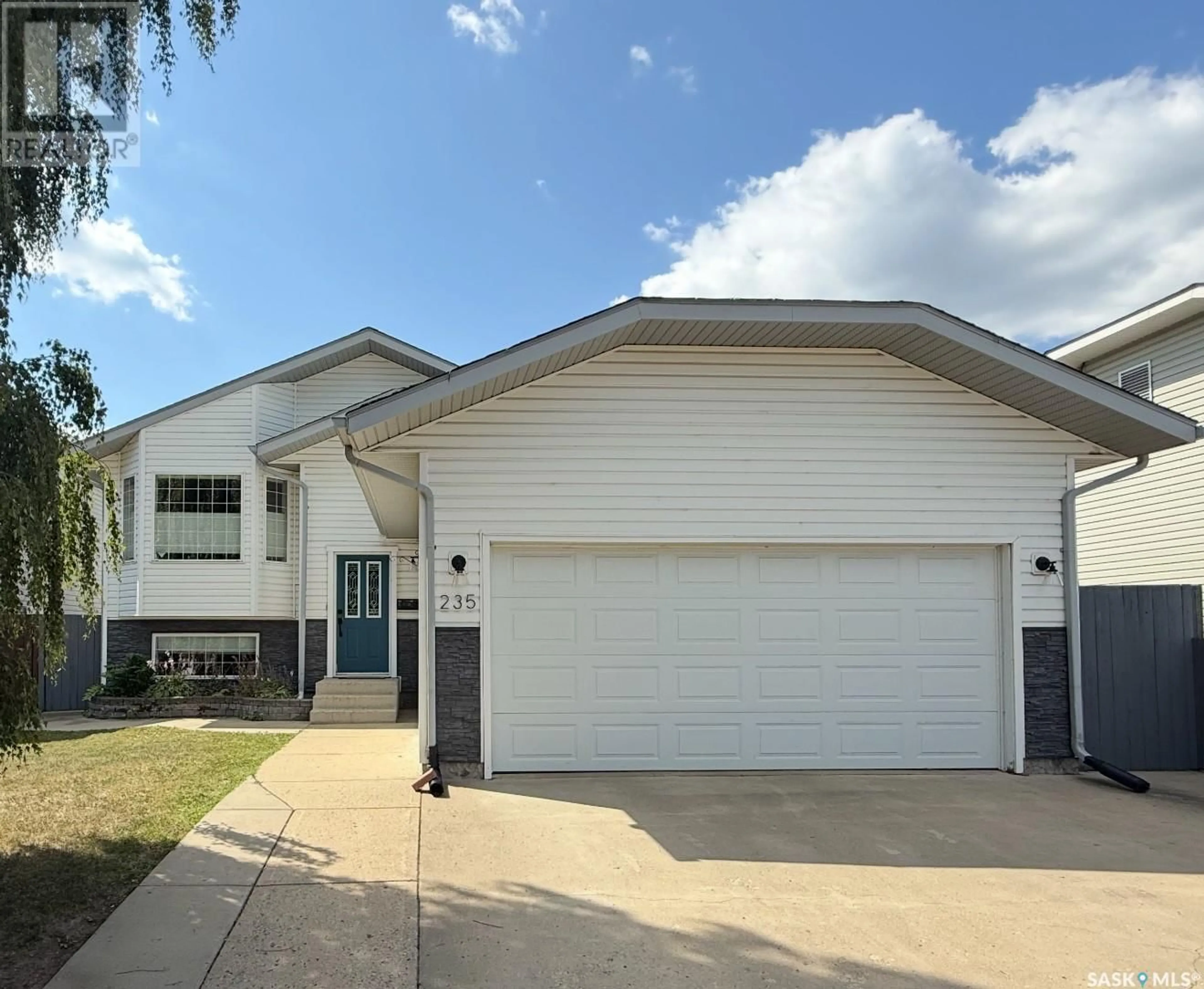 Home with vinyl exterior material, street for 235 SOUTHWOOD DRIVE, Prince Albert Saskatchewan S6V8E7