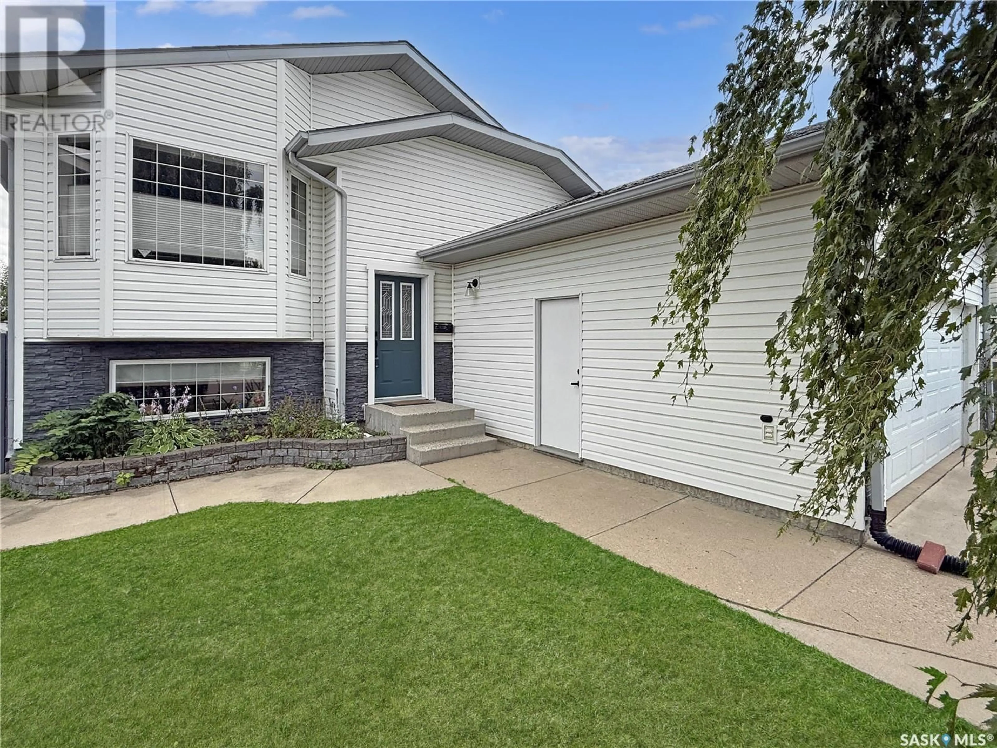 Home with vinyl exterior material, street for 235 SOUTHWOOD DRIVE, Prince Albert Saskatchewan S6V8E7