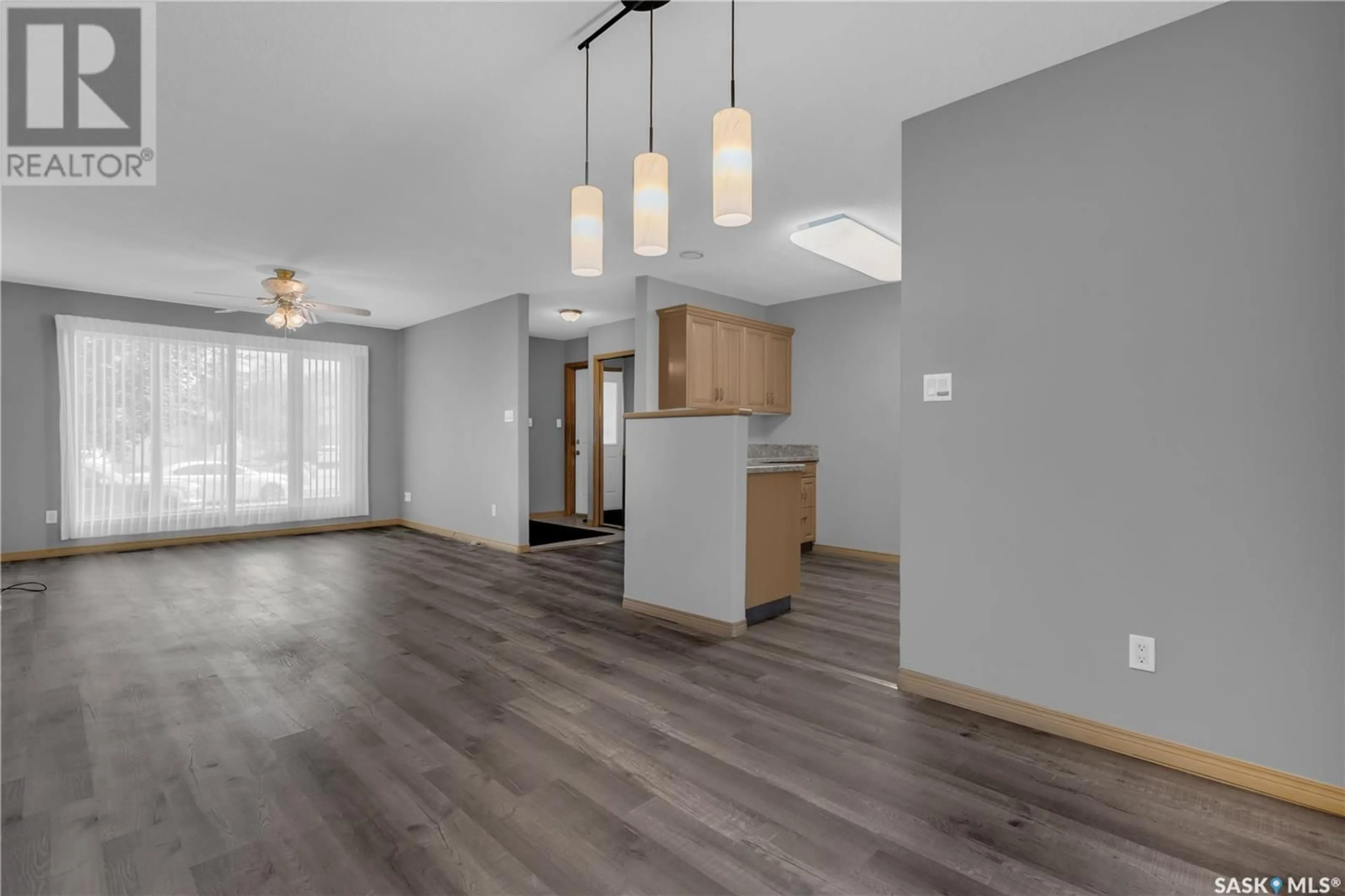 Open concept kitchen, wood/laminate floor for 3140 RENFREW POINT, Regina Saskatchewan S4V2Y3