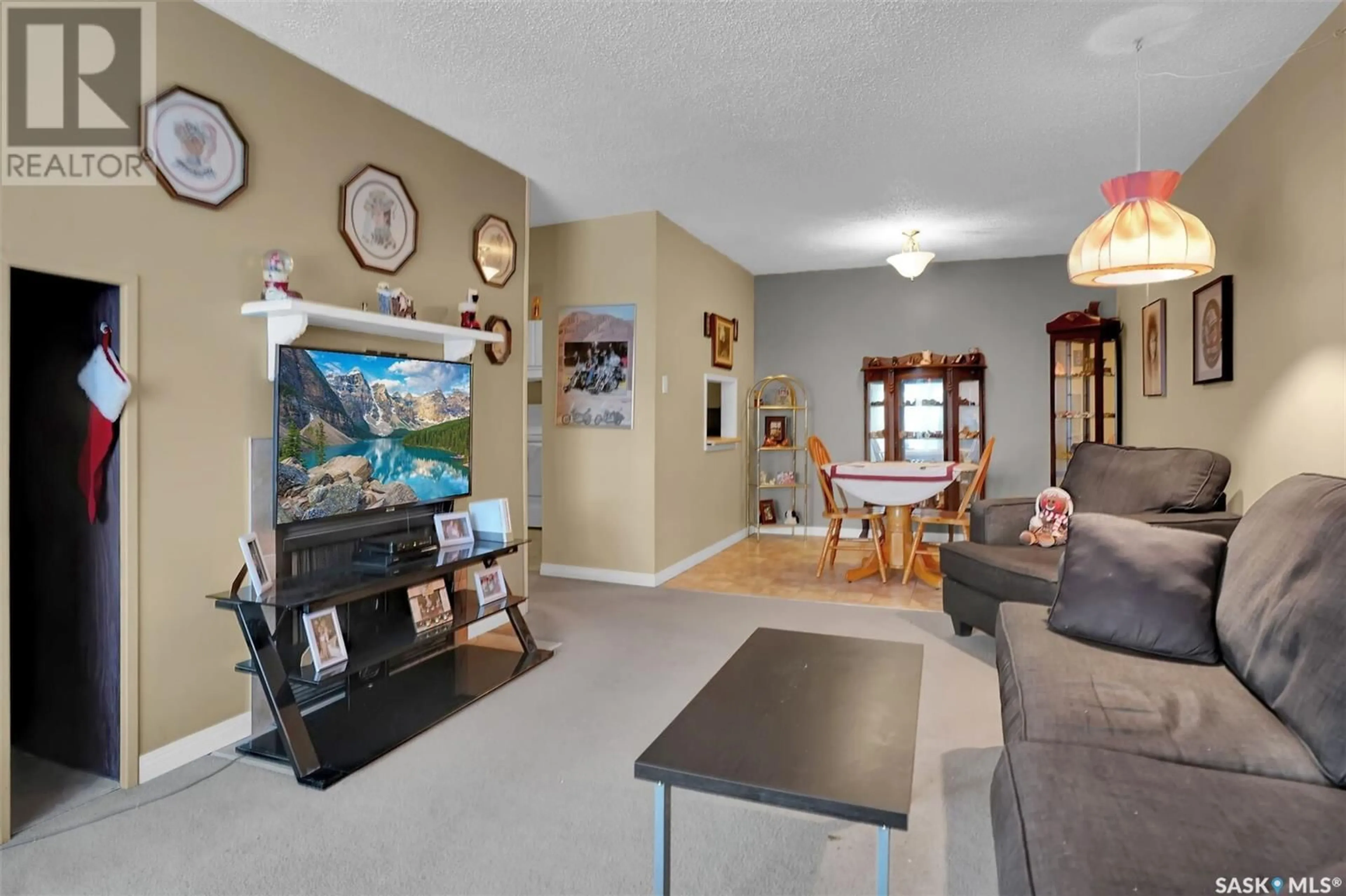 Living room with furniture, ceramic/tile floor for 78B NOLLET AVENUE, Regina Saskatchewan S4T7T9